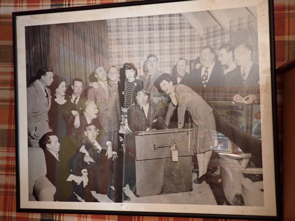 Framed Photo of Laurel and Hardy and Other Stars: Frame: 17" x 21". Jimmy Durante and Other Stars. Image has some creasing.