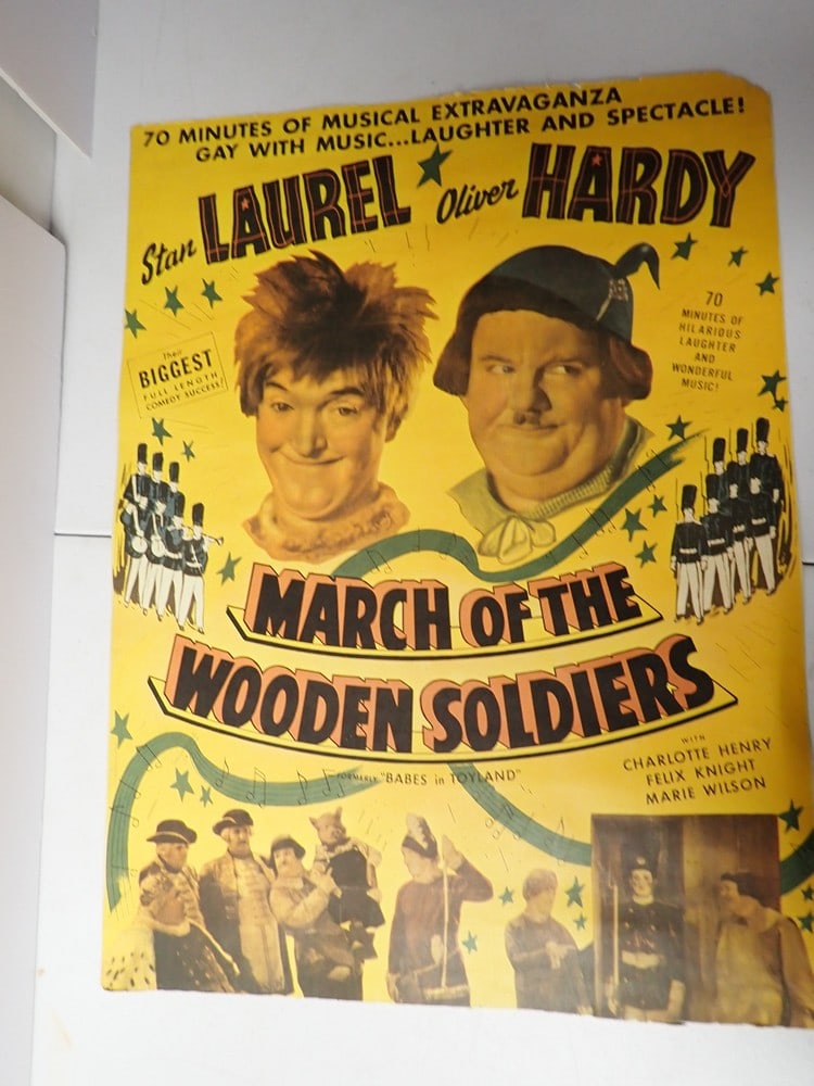 1934 Laurel and Hardy March Of The Wooden Solidiers: 1934 Original Movie Poster. Has been trimmed 24" x 18". Formerly "Babes in Toyland" Their Biggest Full Length Comedy Success! Bottom is unevenly trimmed and is chipped in top corner.