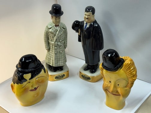 Laurel and Hardy Decanters: Caricature bust decanters marked Balboa Italy Hardy 8" and Laurel 9". Ezra Brooks Laurel and Hardy Decanters Signed on Bottom.