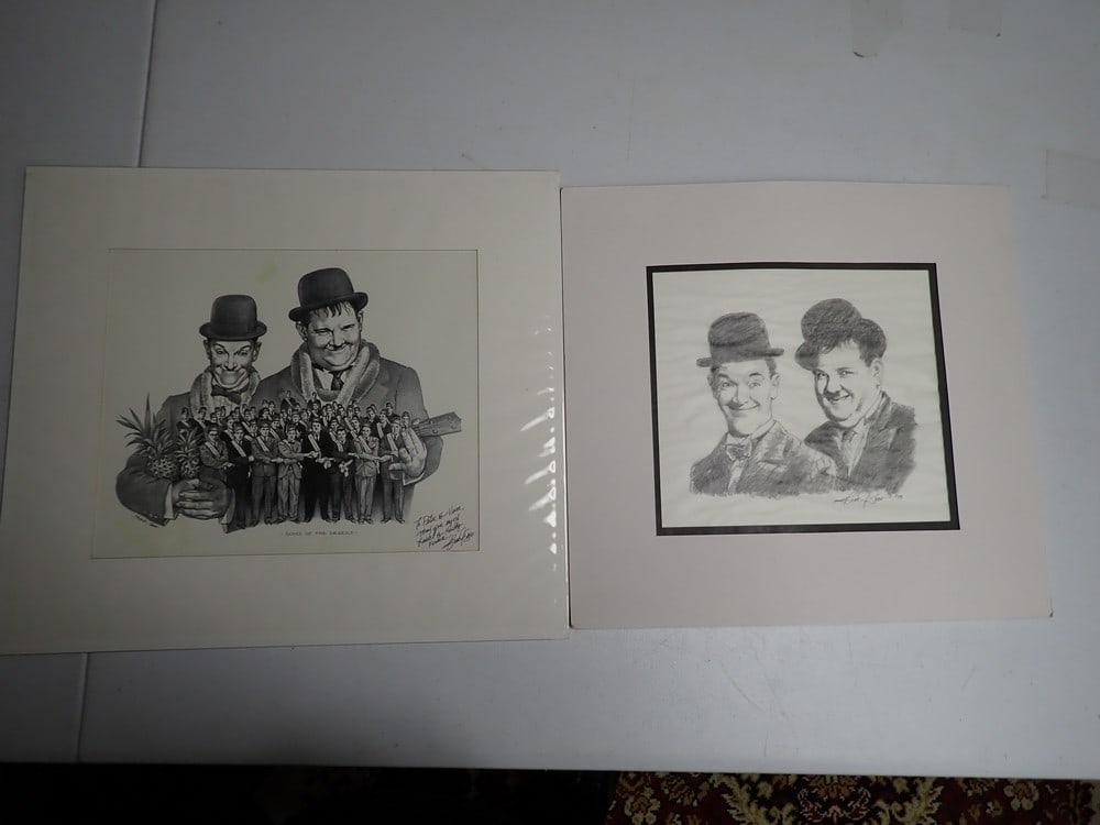 Frank Sasso Laurel and Hardy Sons of Desert & Other: Signed Print. Print of Hardy with Eucalele and Laurel with Pineapples with Sons of Desert members in foreground. Says "To Peter & Viva, May you enjoy Laurel and Hardy forever Frank J. Sasso. Matte: 16