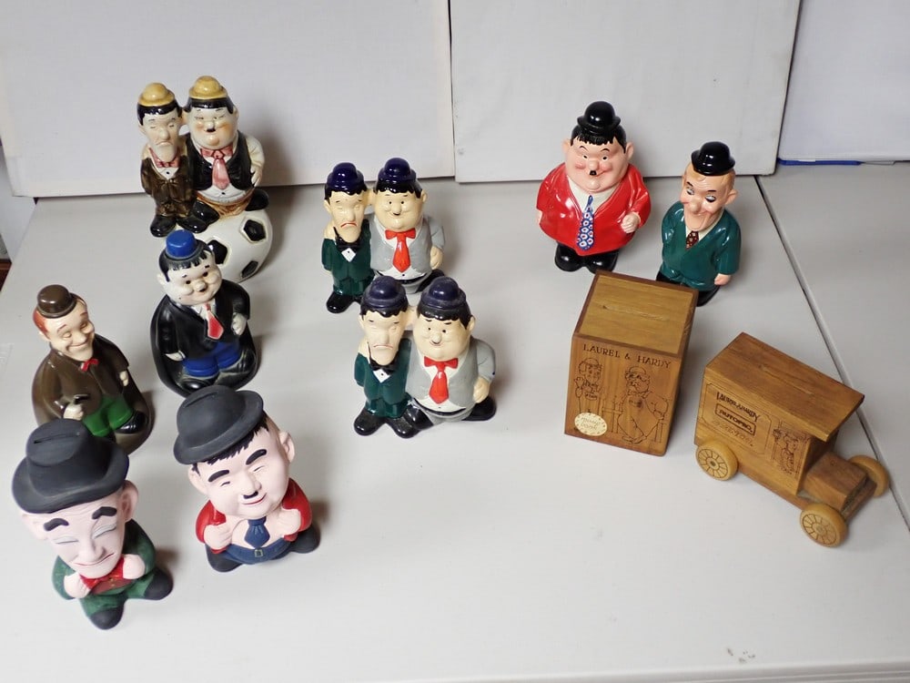 Laurel and Hardy Ceramic, Plastic and Wooden Banks: Ceramic bank depicts Laurel and Hardy on top of soccer ball 9", smallest ceramic bank is 7", Wooden Music Box Bank 1978 Larry Harmon Toystalgia 5 1/4", Laurel and Hardy Wooden Antique Truck Bank 1978