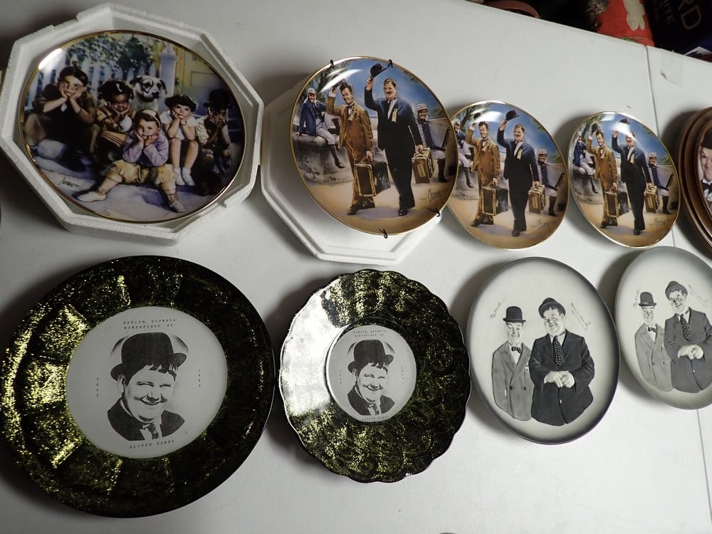 16 Laurel and Hardy Collector Plates: 1 Little Rascals and 15 Laurel and Hardy. Size range from 5" - 9". The one with a wooden frame is 11". Plates include, Great Entertainment Series and Other Makers. Suns of the Desert Plates have some 