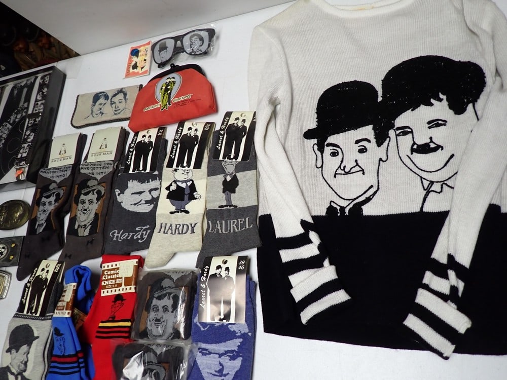 Laurel and Hardy Ties, Belts & Buckles, Socks, Sweater,: and Other Items. Laurel and Hardy size Large Acrylic Sweater (some staining and wear), Bowtie and Cumber Bund set in Box, Bowtie and Suspenders Set in Box, Collapsible Necktie, Laurel and Hardy Red Cl