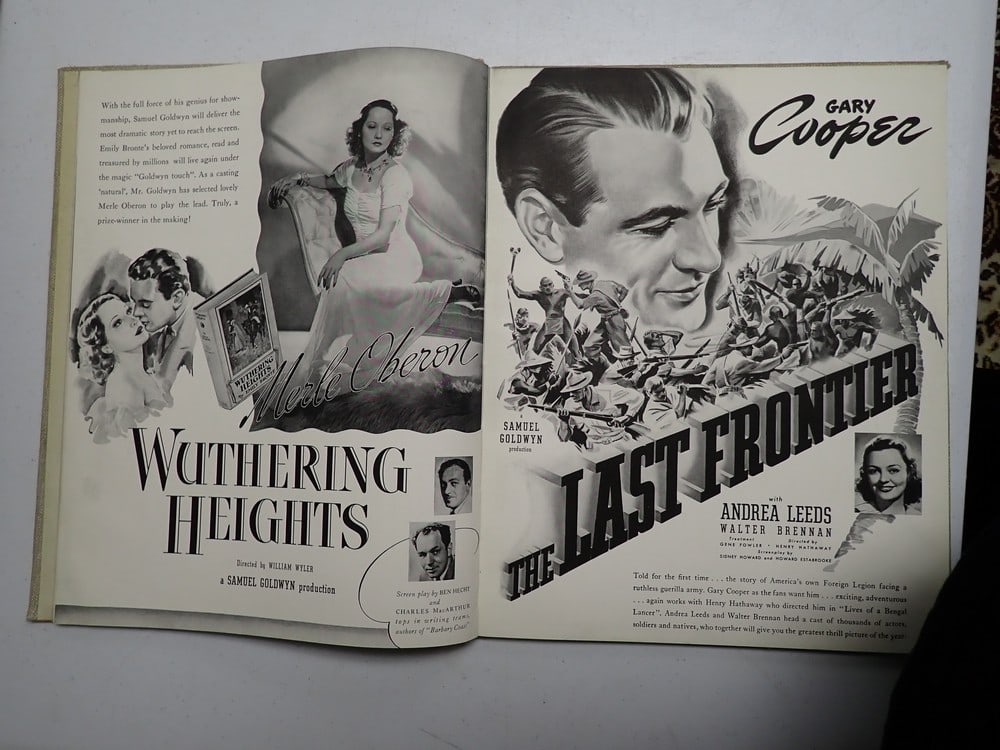 Six United Showman United Artists Promotional Book: Shows movies from different movie producers. One page shows Laurel and Hardy. Other pages show other movies like Wuthering Heights. Both covers are written on, but inside pages are in good condition.