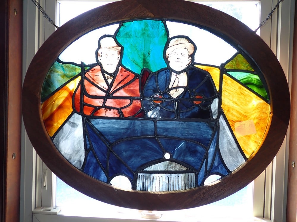 Laurel and Hardy Stained Glass in Oval Wood Frame: Frame: 22" x 28". Glass 18 1/4" x 24". Has multiple cracks.