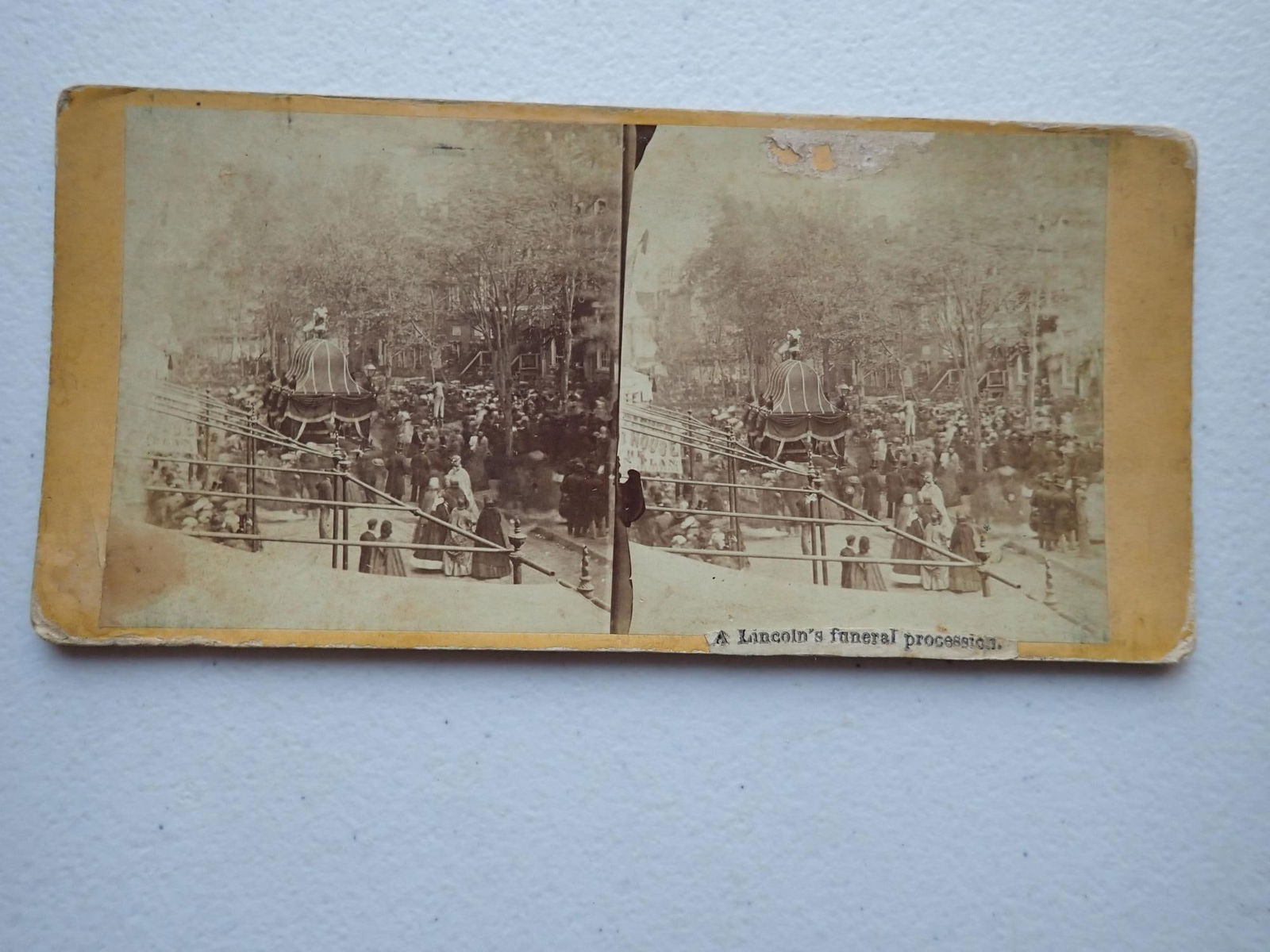 Abraham Lincoln Funeral procession stereoview: Provenance 2019 online auction. Original description: "Stereoview identified as "Lincoln's Funeral Procession" and pictures the President's elaborately draped coffin in the middle of a street lined