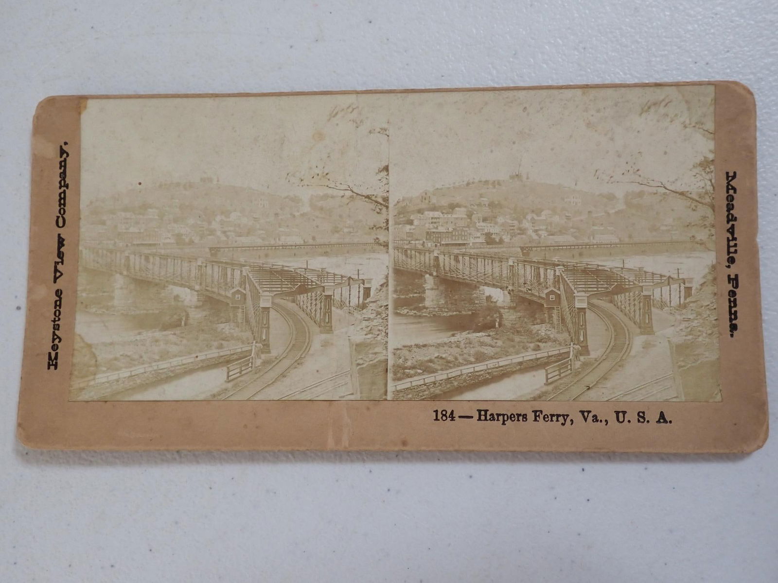 John Brown's Family , Harper's Ferry Photos, etc.: John Brown's children cabinet photos with John Brown Jr., Jason Brown, Owen Brown, and Ruth (Brown) Thompson. 5 1/4" x 8 1/2". Edge wear but good condition. Stove that is believed to be from John