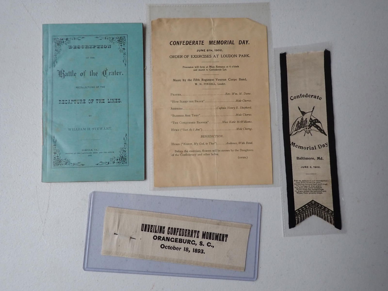1893 Unveiling of Confederate Monument CSA, etc.: 1893 Unveiling of Confederate Monument ribbon, & other CSA items. 1876 Battle of the Crater Confederate response pamphlet. June 6, 1902 Confederate Memorial Day program and ribbon.