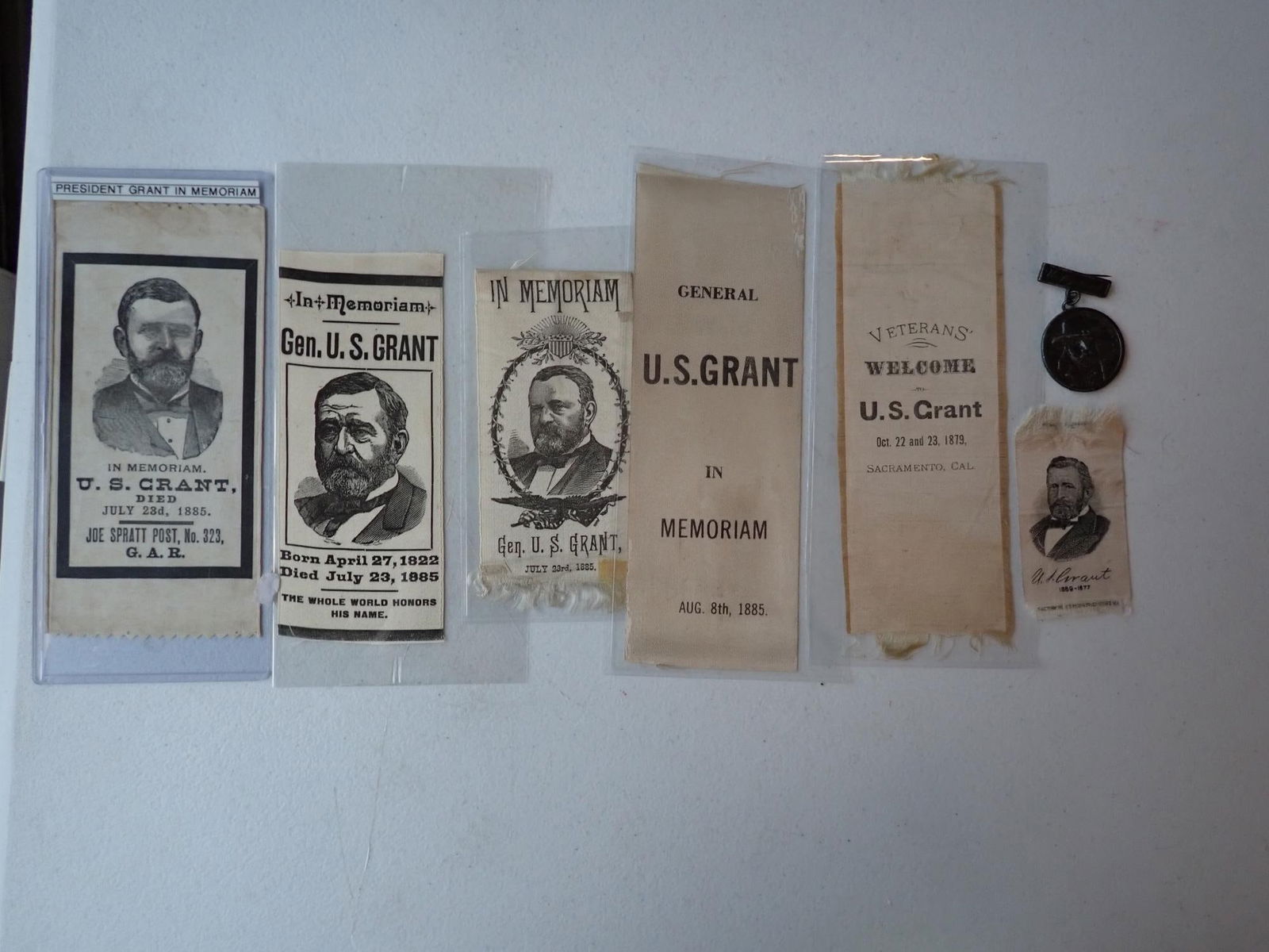 Ulysses Grant memorial ribbons & badge: 1879 GAR Veterans welcome Grant and 1885 in memoriam ribbons