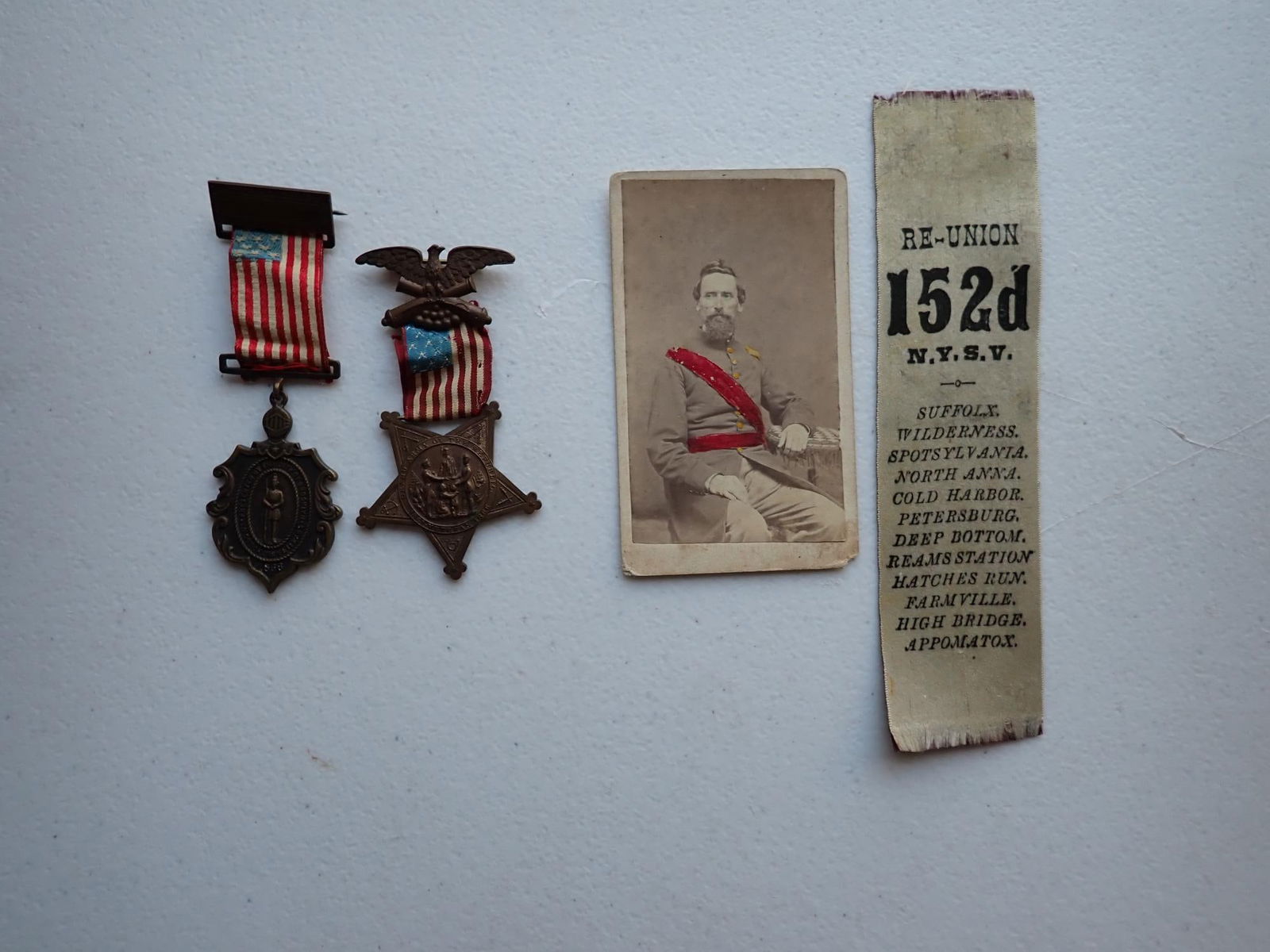 NY James Henderson 19th Inf. Uriah Kendall 152nd: New York Pvt James Henderson 19th Infantry. Uriah Kendall 152nd items. 2 of Henderson's GAR badges. Capt. Uriah Kendall signed CDV and 152nd NYSV ribbon.