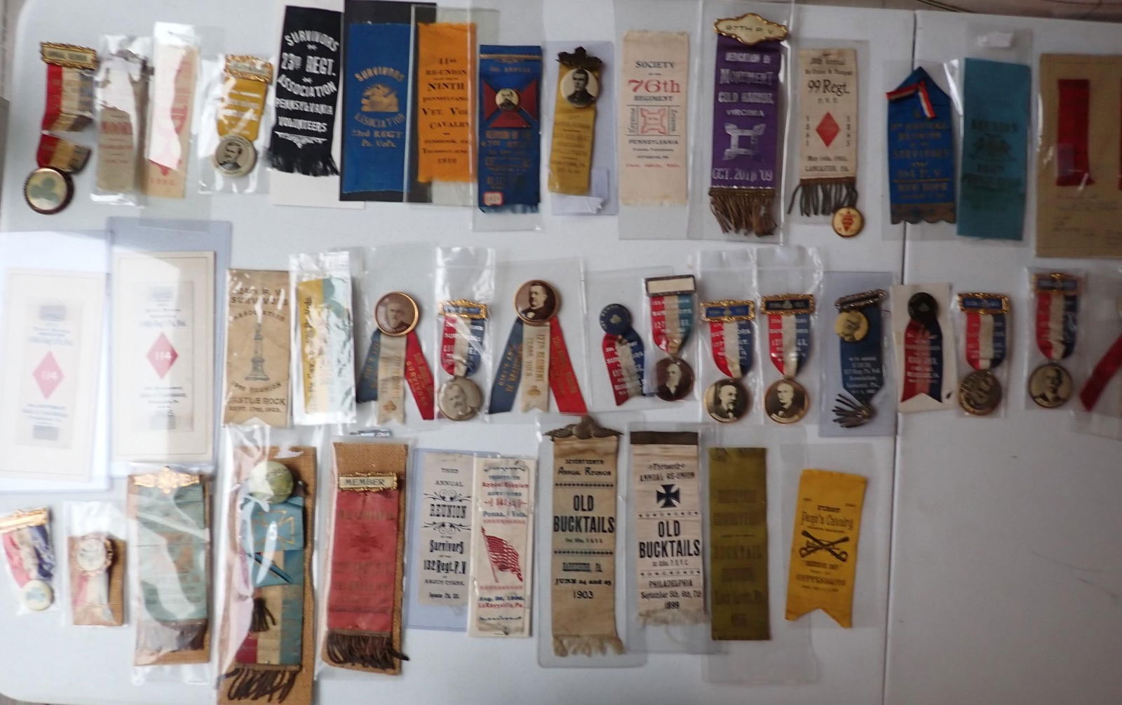 Pennsylvania Regiment Veterans Ribbons & Medals 149th Bucktails, etc.: 104th PA Volunteers. Writing on card attributes them to J. William Gault, Pvt Co. B, 104th Regiment. Picture medals from 127th Regiment & others.