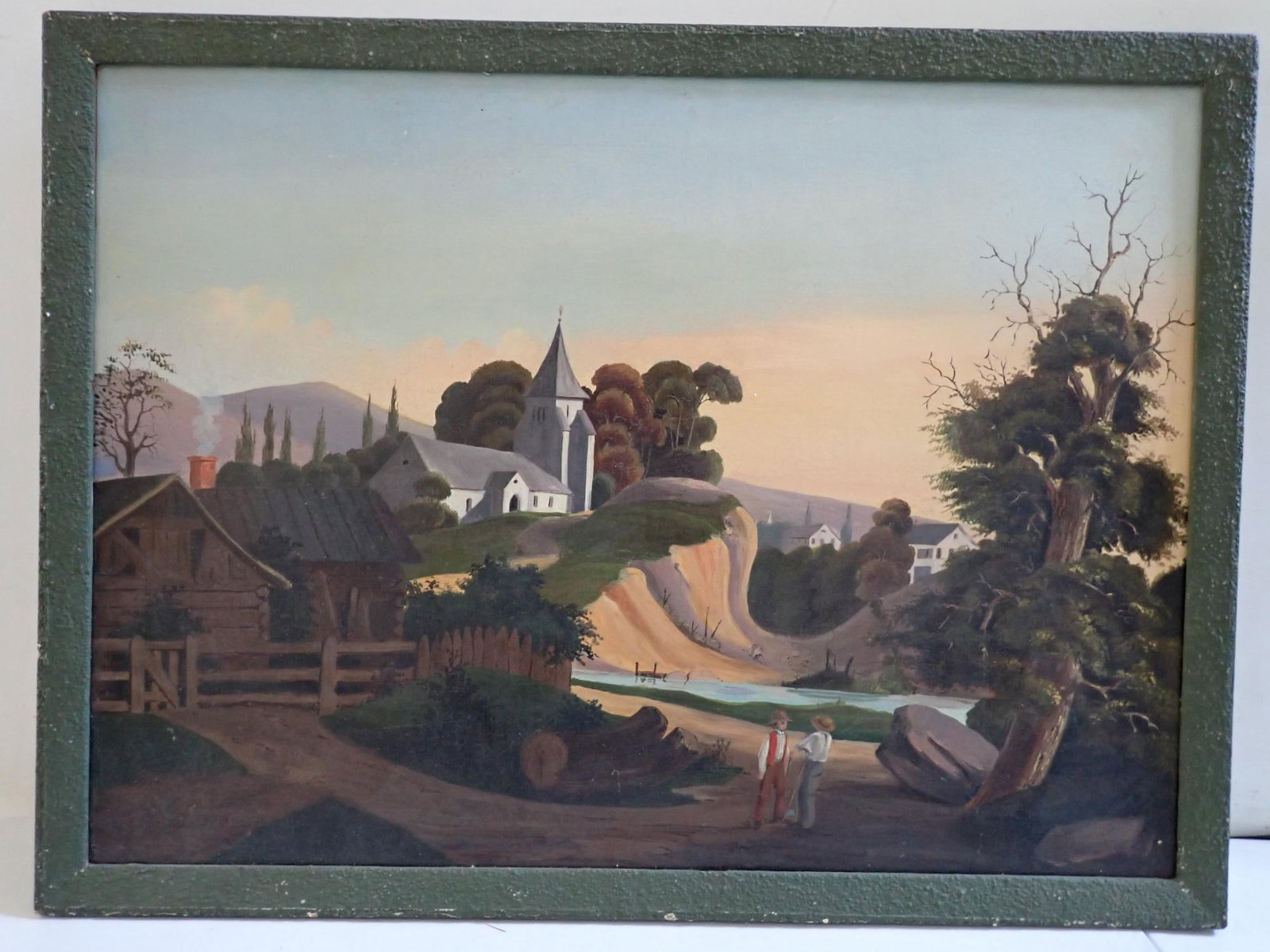 Primitive Folk Art Oil on canvas painting: Church on hill with river and valley, Two men chatting in foreground. Art 22" x 30". Frame 23 3/4" x 31 3/4". Not signed on painting but writing on back of frame attributes it to Thomas Chambers. Info