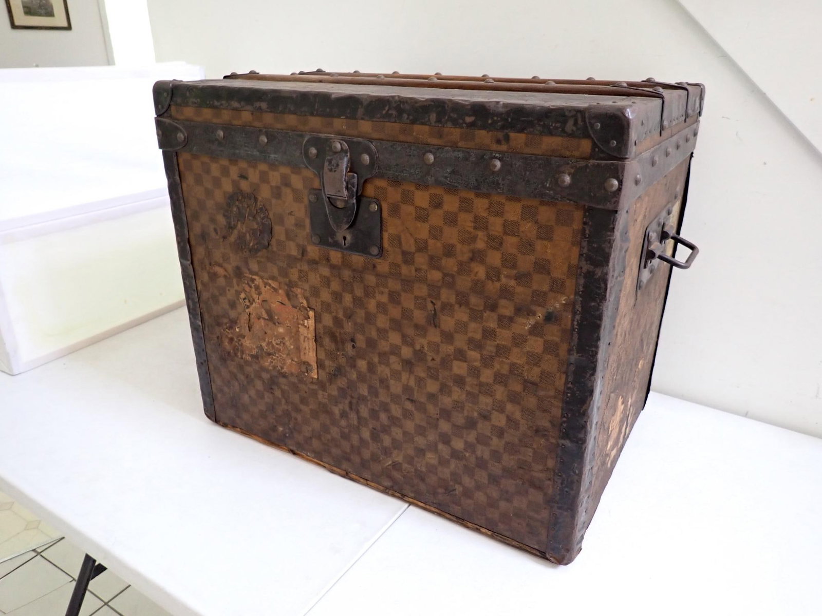 Louis Vuitton Antique Travel Trunk: 24" x 16 1/2" x 20 1/2" high. Has original label and insert. Shows some wear (most noticeably on sides). Has key.
