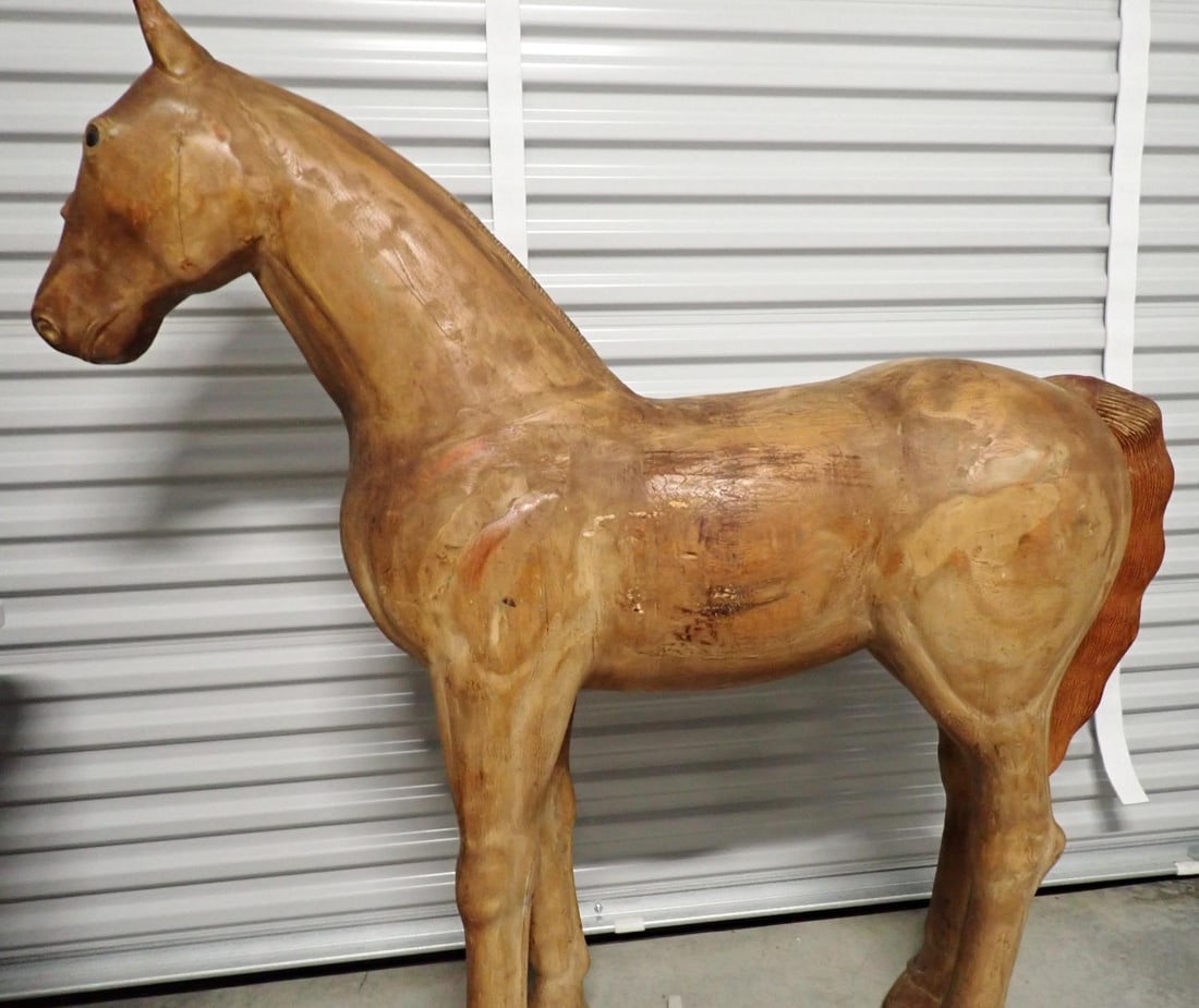 Pony size carved wooden horse: 4' 10" high x 4' 9" wide. Wood is splitting in spots but overall good condition.