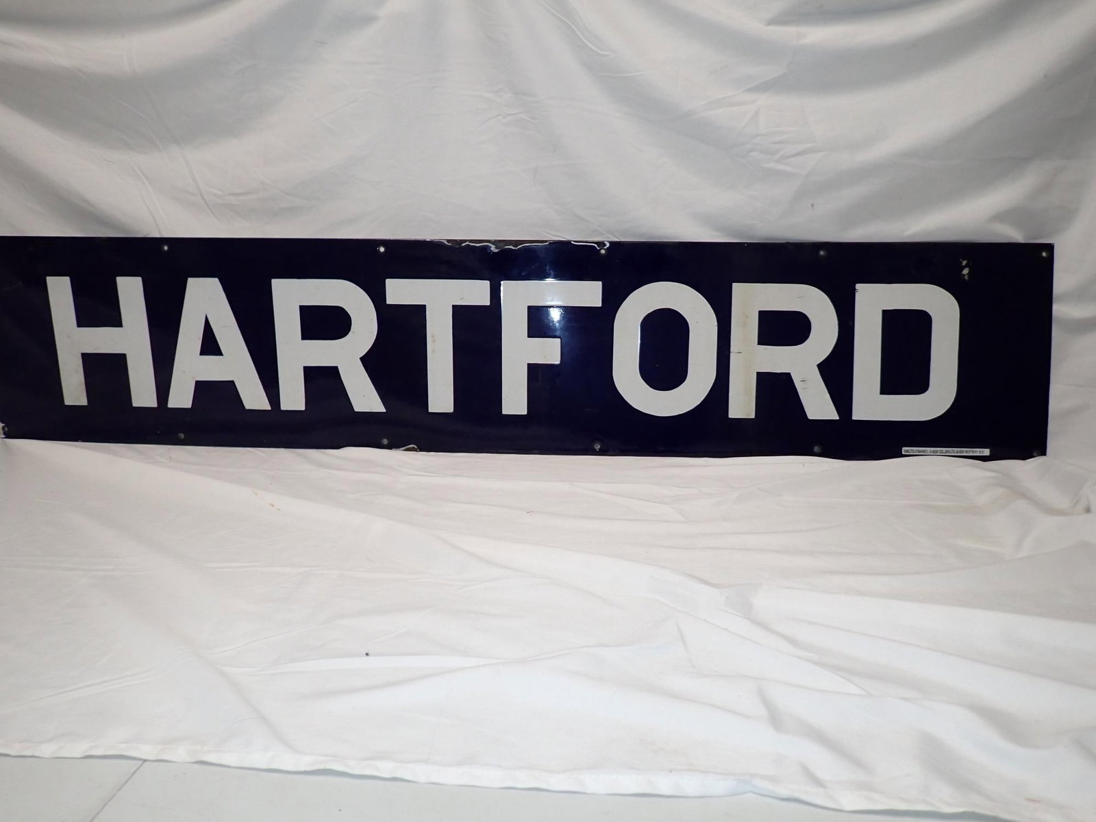 Hartford Enamel Railroad Station Sign: 10 1/2" x 53". By "Balto Enamel & Nor Co. Bal to & 190 W. B'way, NY". Some enamel loss most noticeable in the top center, but overall good condition.