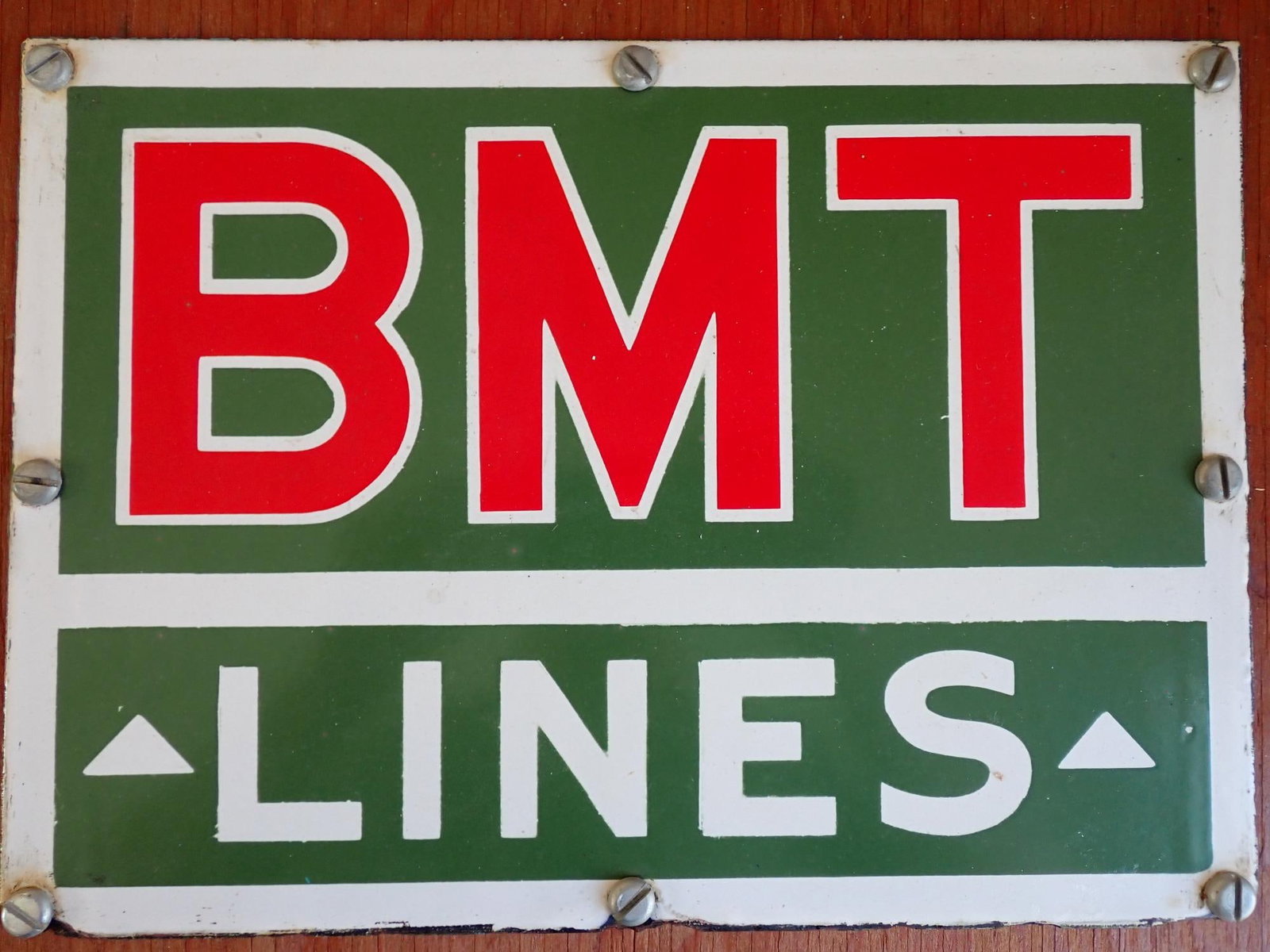 1915 Brooklyn Manhattan Transit Lines Enamel Sign: Provenance: Consigner said that he acquired the sign from the 36th Street and Fourth Avenue Subway Station in 1975 when construction was taking place on the station. Sign 9" x 12 1/2". Mounted on 14"