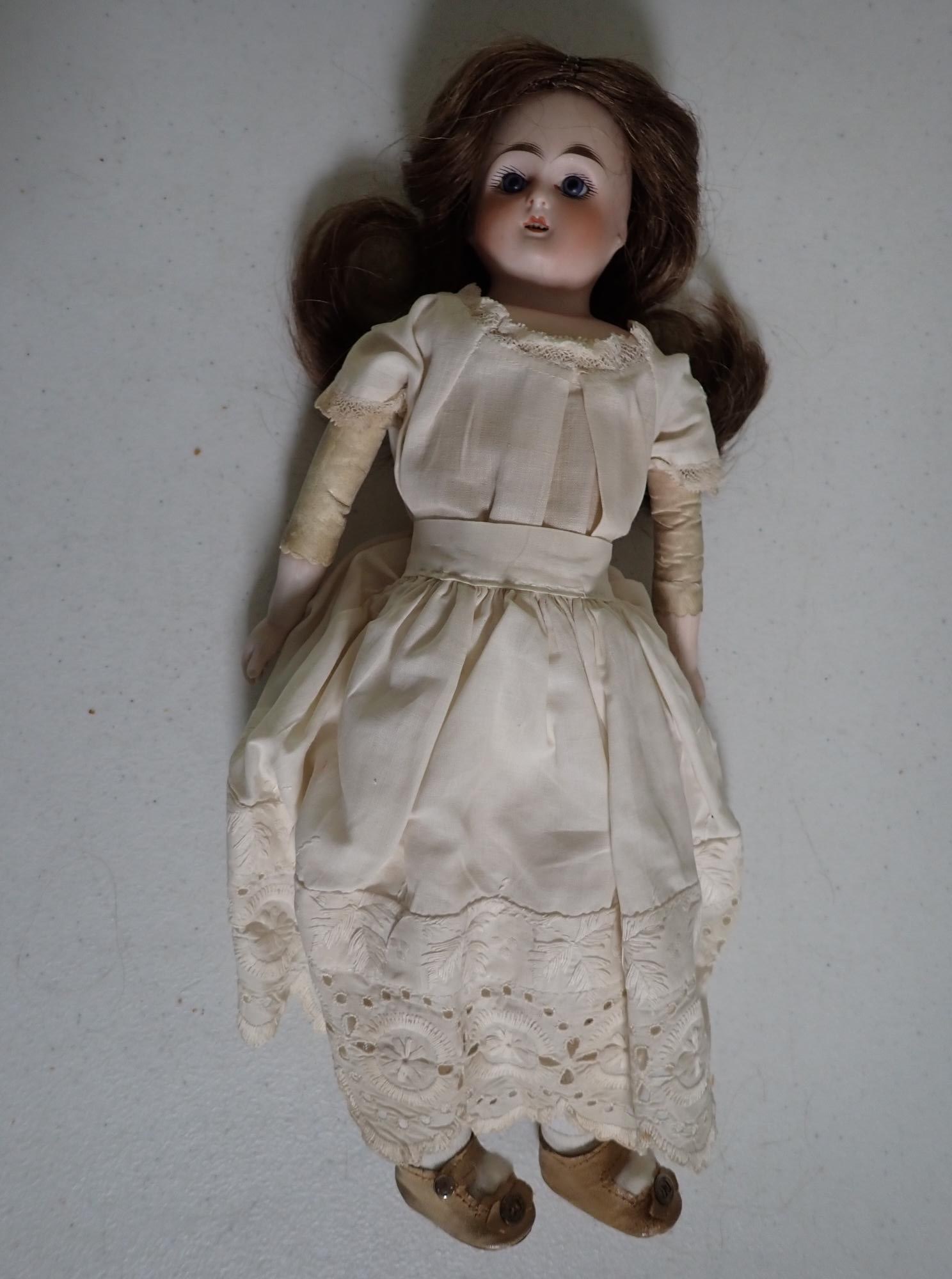 Late 19th century bisque doll with provenance: 14" with note. Note says "Dear Gail - When I'm gone this doll and the other antiques in this drawer are for you. The doll is very old - pre 1878 - it is bisque with kid body and has been re-dressed &
