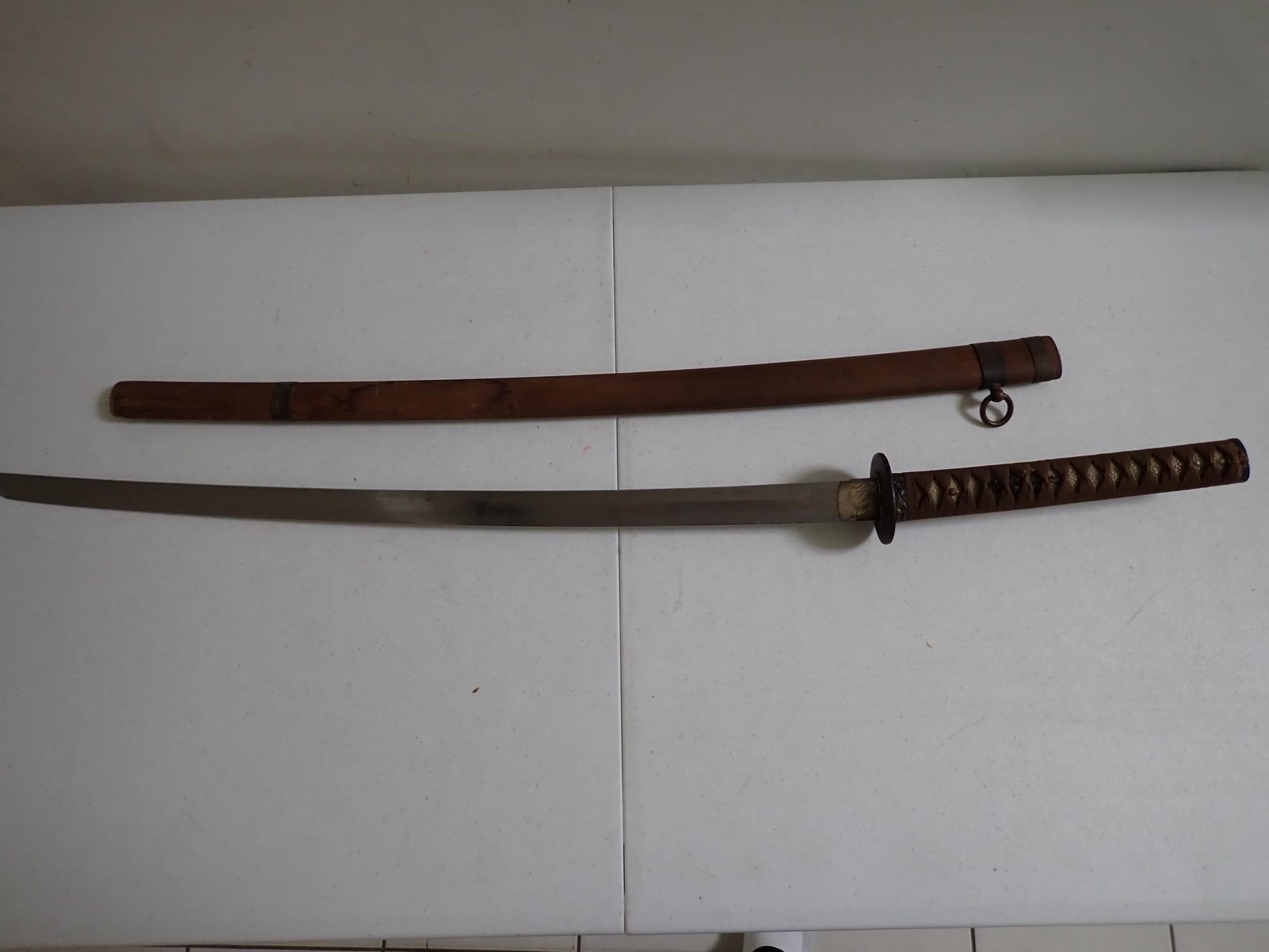 Samurai sword signed by maker: Sword 38." Blade 28." Blade was oiled at some point