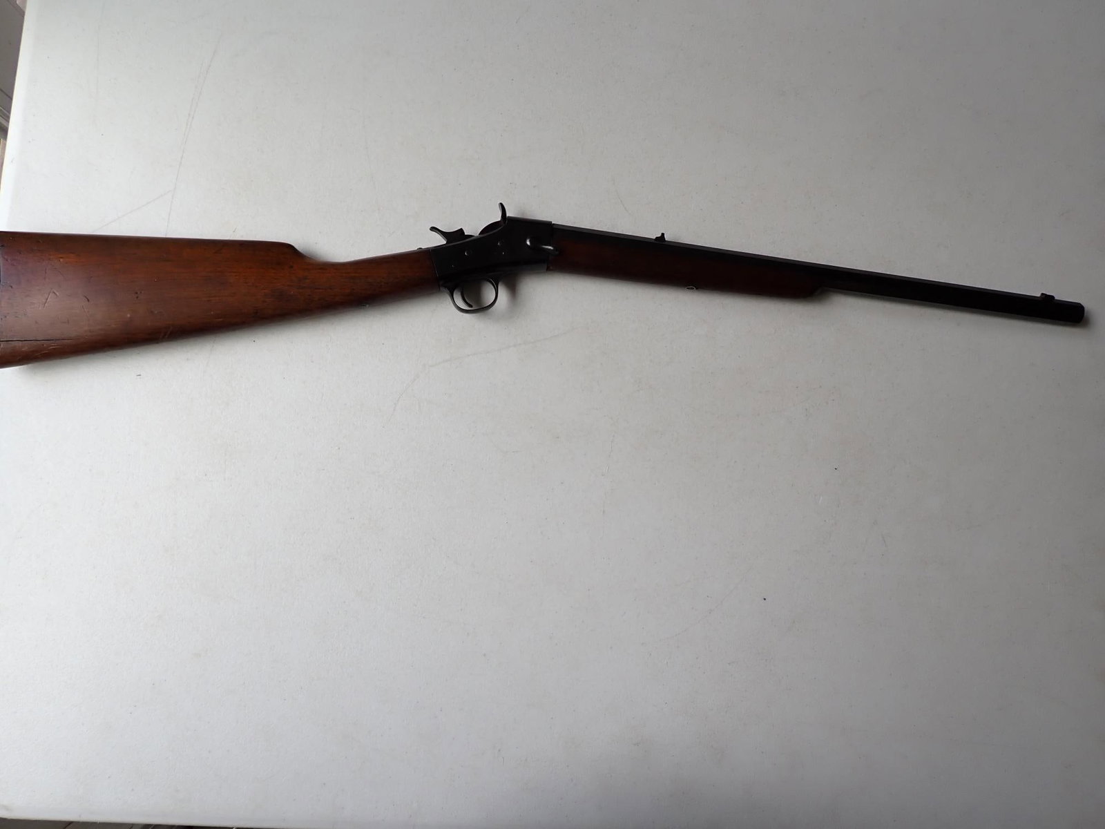 1892 Crescent .32 Caliber Rifle: Barrel is marked ""New York Club" Pat. April 14, 1892". Firing mechanism works. Stock has chipped. Otherwise, overall good condition.