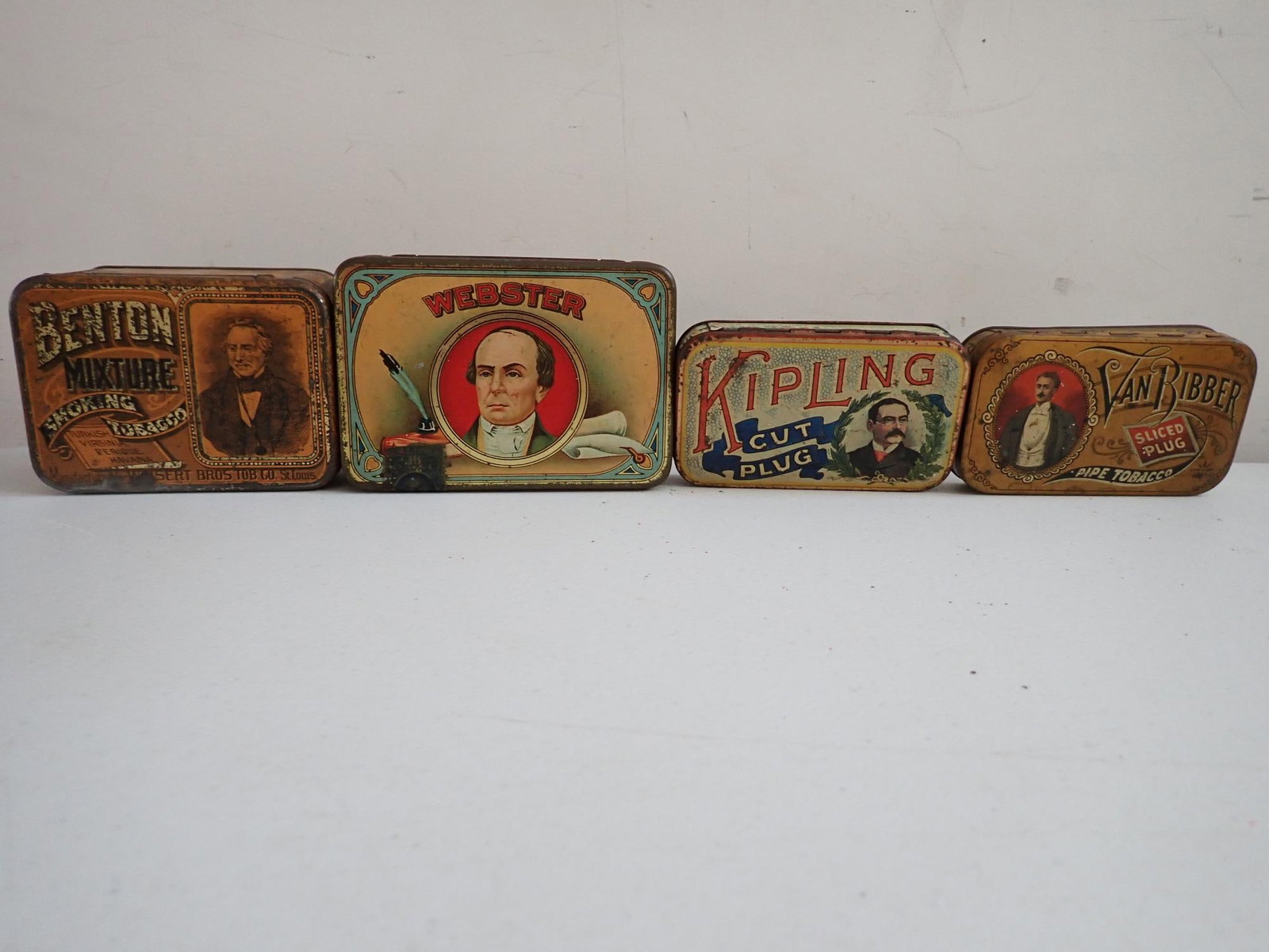 Rudyard Kipling, Daniel Webster, other Tobacco Tins: Daniel Webster tin by "Webster Cigar Company." Some wear, but overall good. Kipling Cut Plug, some wear, but presentable condition. Van Ribber Sliced Plug Pipe Tobacco, some wear, but presentable