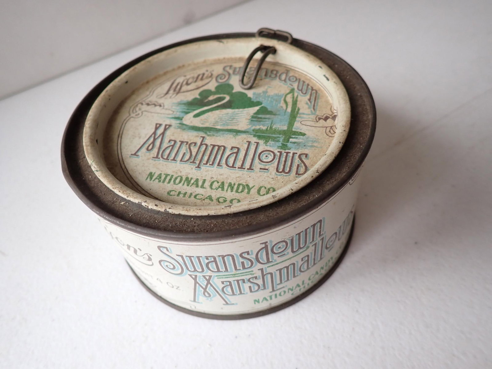 Lyon's Swansdown Marshmallow Tin: 4 1/4" diameter. 2 1/4" height. A little wear but overall good condition.
