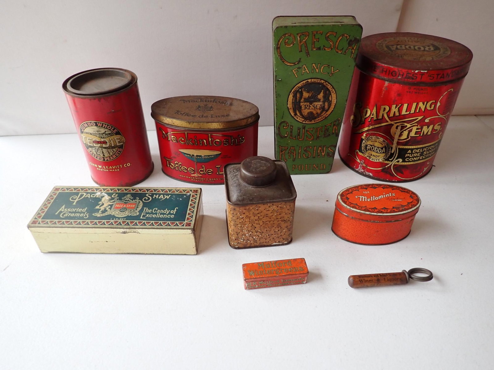 Toffee, Caramels, Peanuts, Cluster Raisins, etc. tins: Cresca Fancy Cluster Raisins - largest 8 1/2". Mulford Wintergreens - smallest 2 3/4."