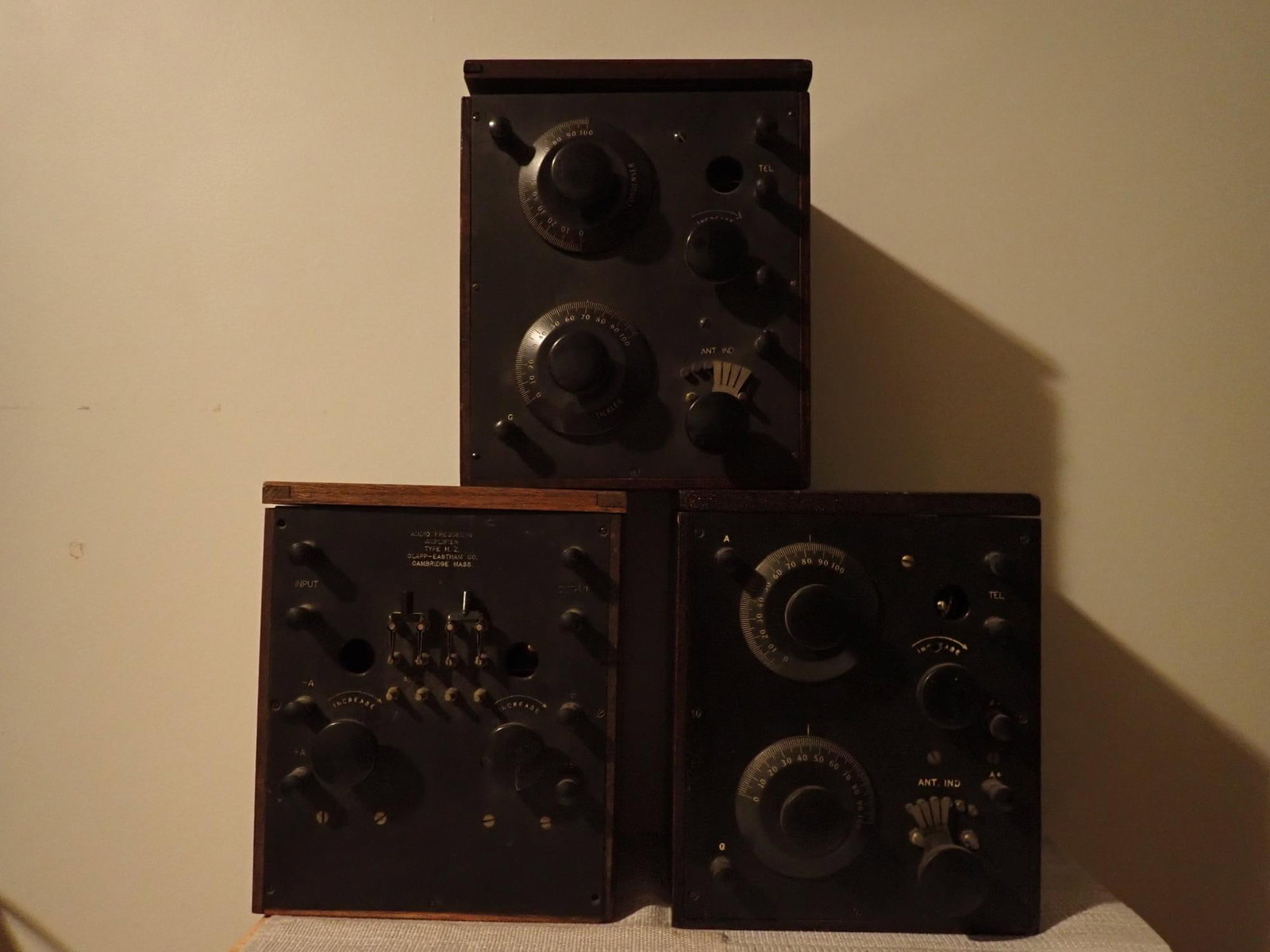 Two 1940's Radio Receivers and One Amplifier: Two antique wooden cabinet radio receivers with dual tuning condensers; Amplifier and one receiver made by Clapp-Eastham Co. Receiver has plate identifying it as TYPE H.R. 175-825 meters . ; 9 1/2"h