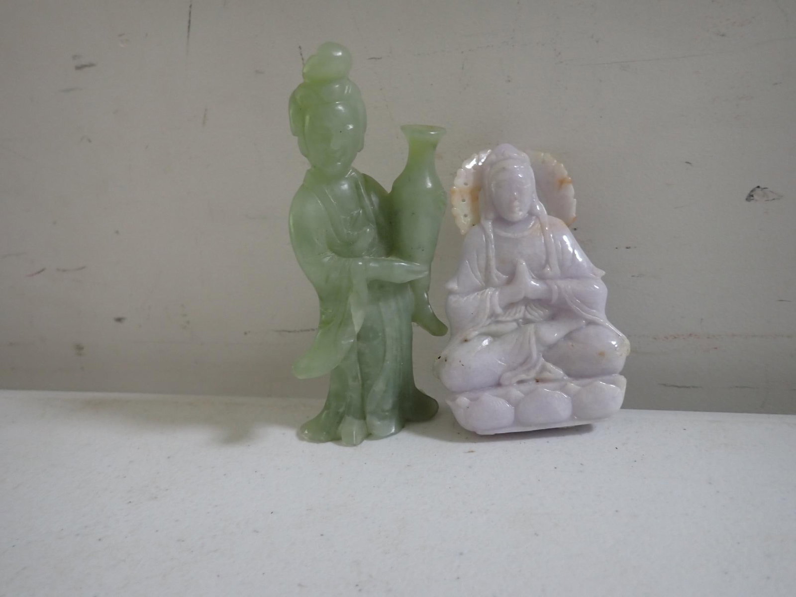 White Jade Buddha and other Jade Figure: White figure approximately 3 3/4". Other figure approximately 4 1/2."