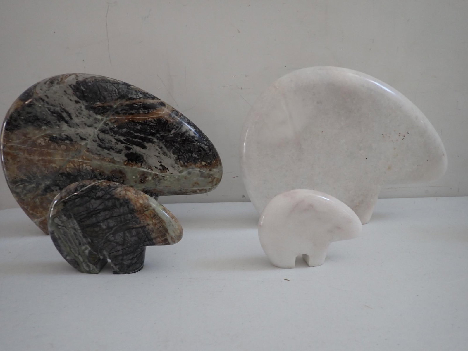 Zuni carved marble mother and baby bear sets: Larger bears are approximately 9". Smaller multi-colored bear approximately 4 1/4". Smaller white bear is approximately 3 3/4".