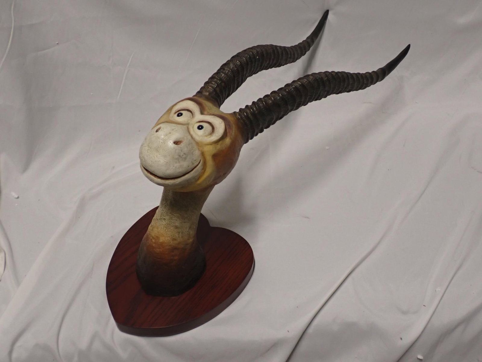 Two Horned Drouberhannis: Two horned Drouberhannis Dr. Seuss Unorthodox taxidermy hand painted cast resin Nose to tip of horns 22" nose to neck 10" packed in original box signed no cp 104/155 wooden hanging plaque 8" x 9."