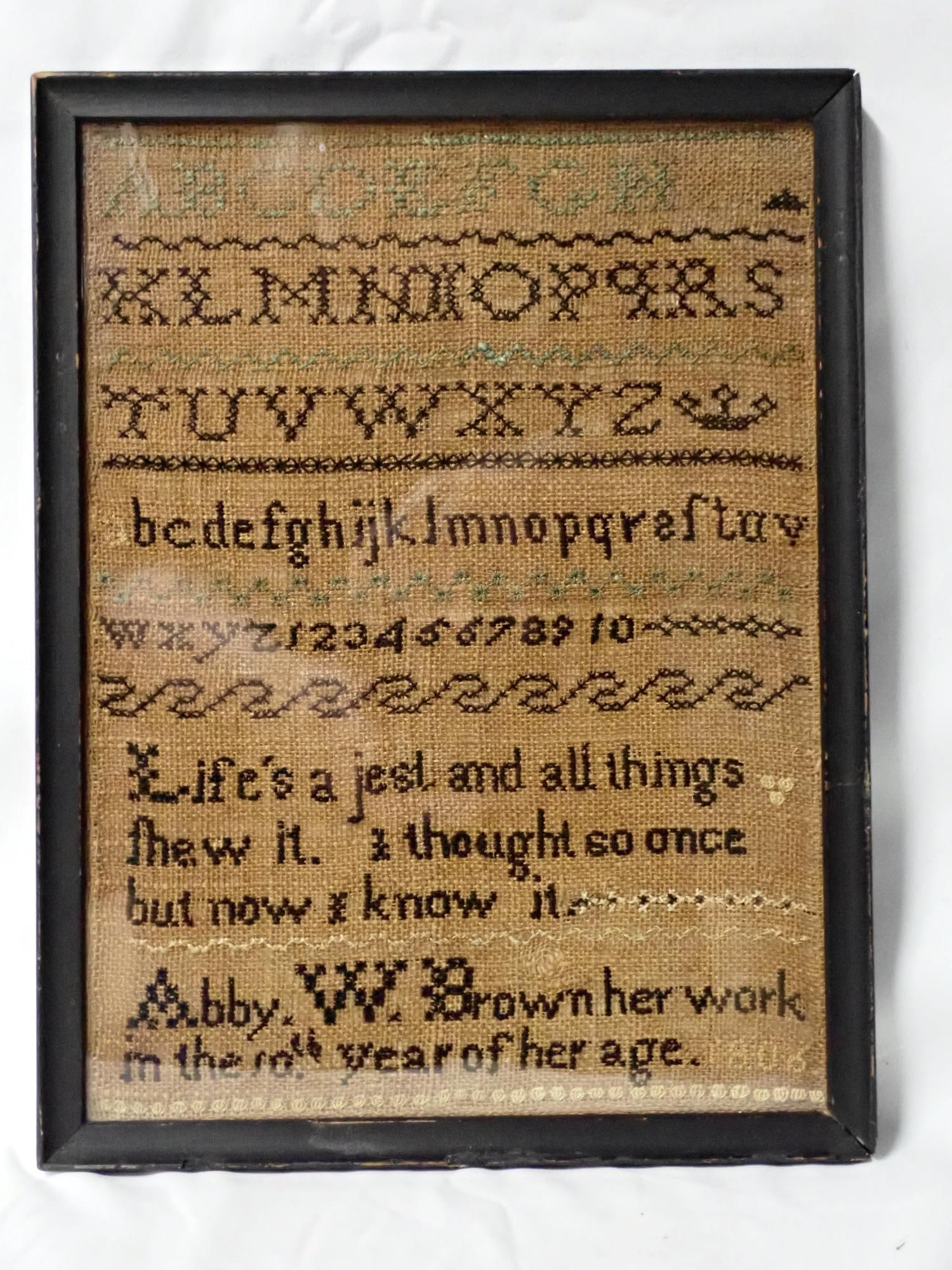 1808 Abby W. Brown sampler: Abby W. Brown her Work in the 10th year of her age. Alphabet, numbers, and verse.some letters are missing, dark discoloration and fading of letters frame 10 1/2" x 8" sampler 9 3/4" x 7 1/4"