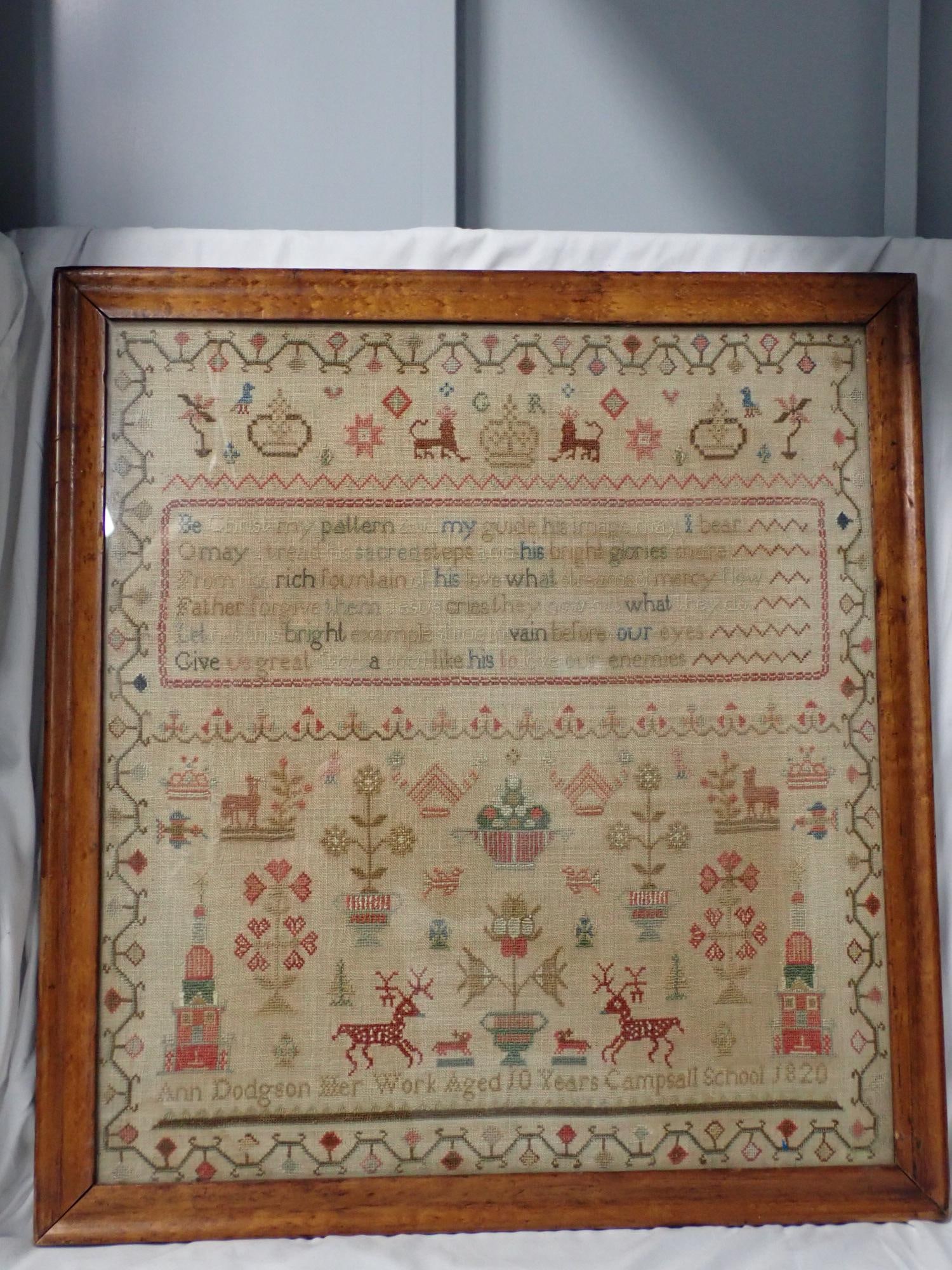 1820 Ann Dodgson sampler: Ann Dodgson Her Work Aged 10 Years Campbell School 1820 Geometrical design with various images, animals, flowers, buildings, etc. Frame 23 1/4" x 21 1/4" Sampler 20 1/4" x 18 1/2"