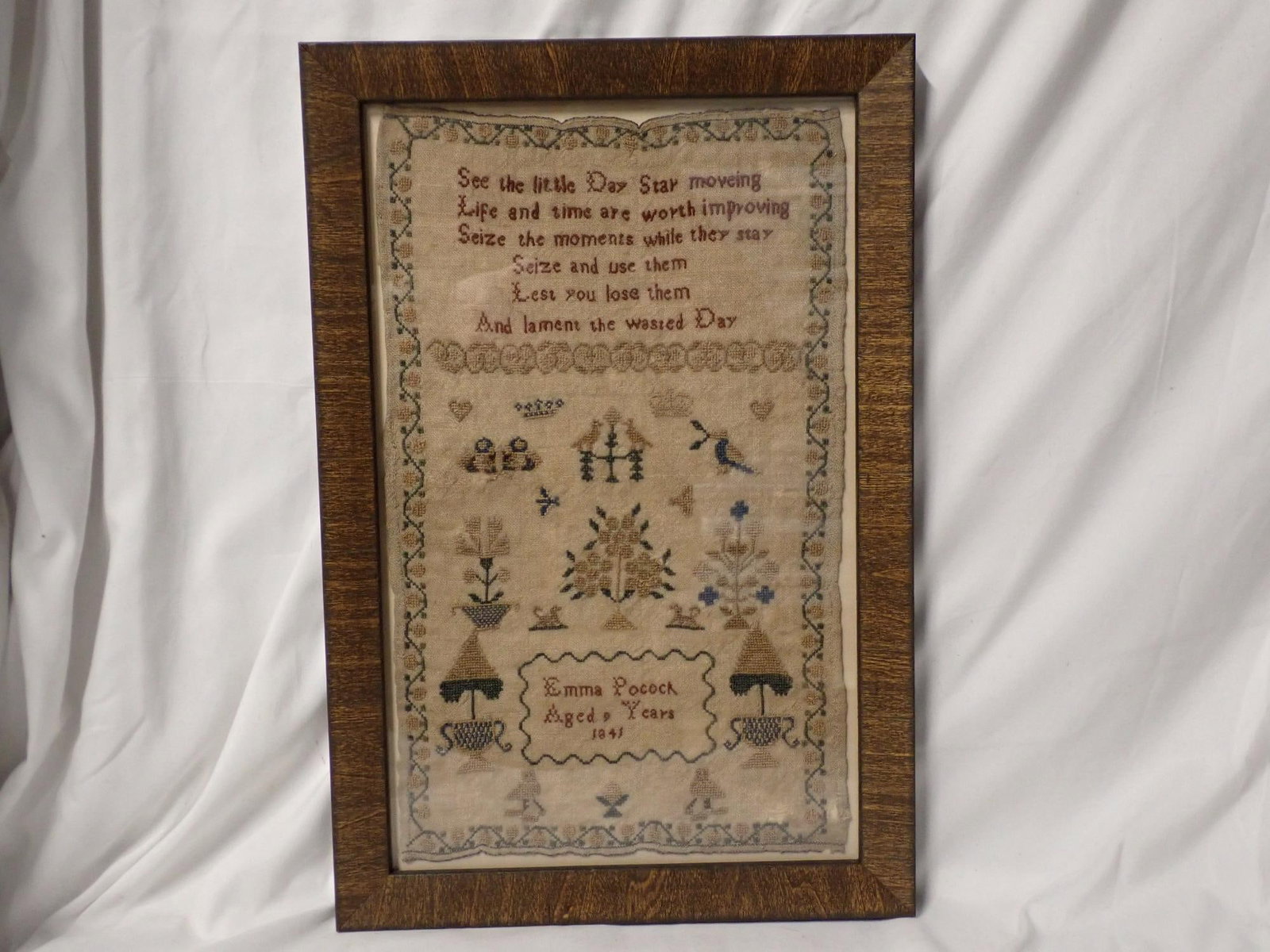 1841 Emma Pocock Sampler: Emma Pocock Aged 9 Years 1841. Verse at top floral and bird design. Some fabric loss bottom right Frame 14 3/4" x 9 3/4" Sampler 12 1/2" x 7 1/2"