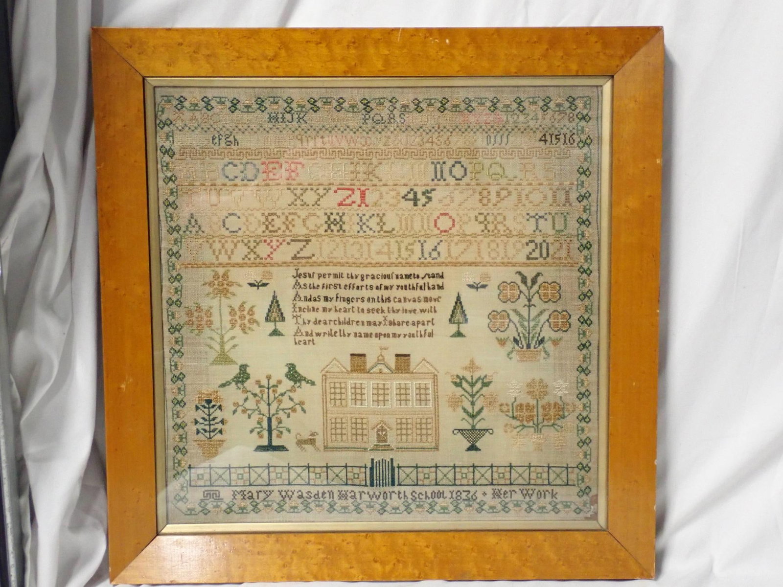 Susanna Ellis sampler: Susanna Ellis (no date) However information on back states probably some time 1830-1840s. Depicting buildings, trees flowers, animals Religious verse Frame 19 1/2" x 24" Sampler 16" x 20"