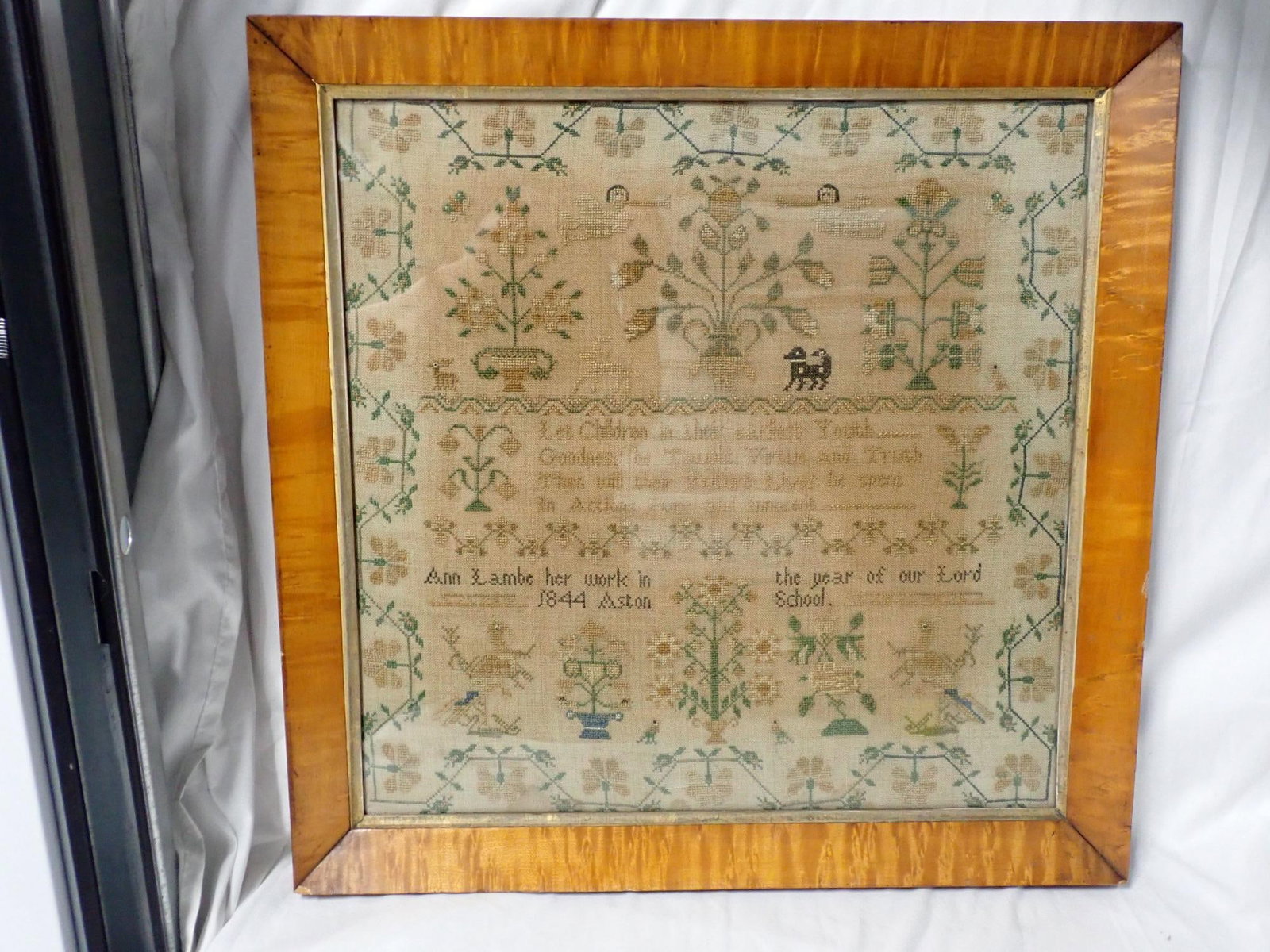1844 Ann Lambe Sampler: Ann Lambe her work in the year of our Lord 1844 Aston School. Floral, design, short Verse. Frame 20" x 20" Sampler 17" x 17." Some discoloration of fabric