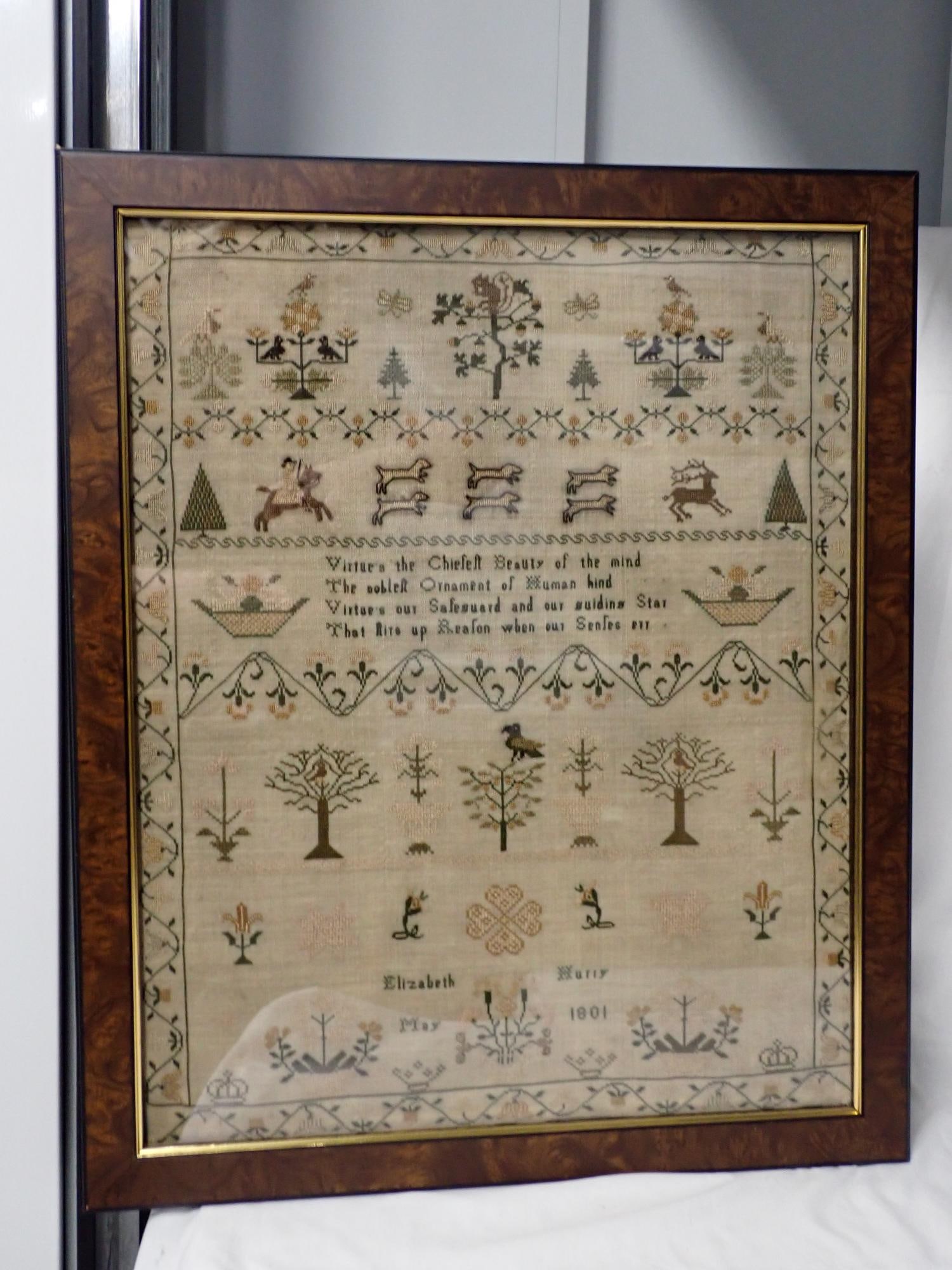 1801 Elizabeth Hurry Sampler: Elizabeth Hurray depicting Flora and Fauna decoration with verse in center Mar 1801 Frame 23" x19" Sampler 20" x 16 1/2" Good condition