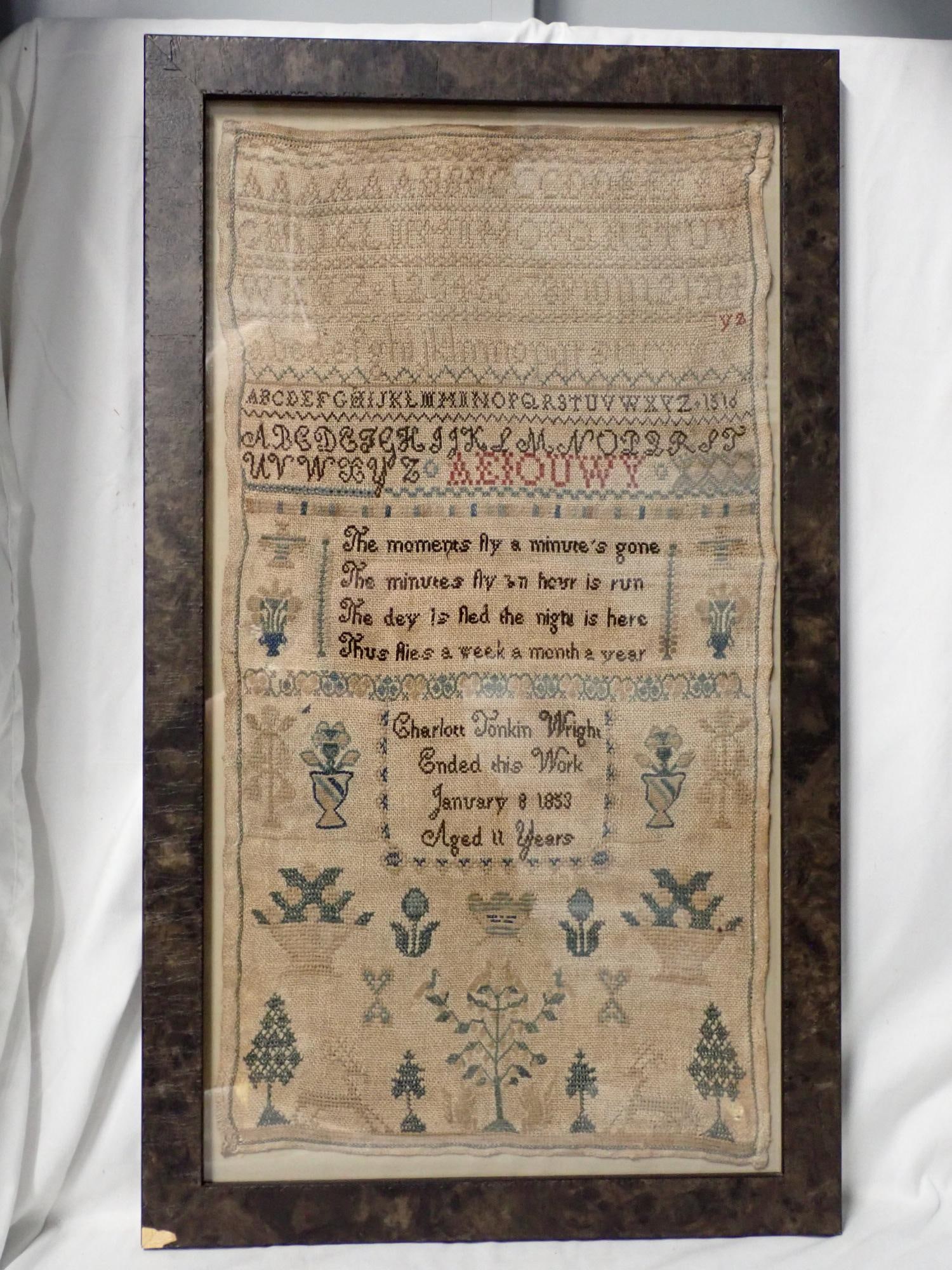 1853 Charlott Tonkin Wright Sampler: Charlott Tonkin Wright ended this work January 8 1853 Aged 11 years, depicting alphabet numbers floral design. verse in center Some fading and minor fabric loss Frame 24" x 14" Sampler 20" x 11"
