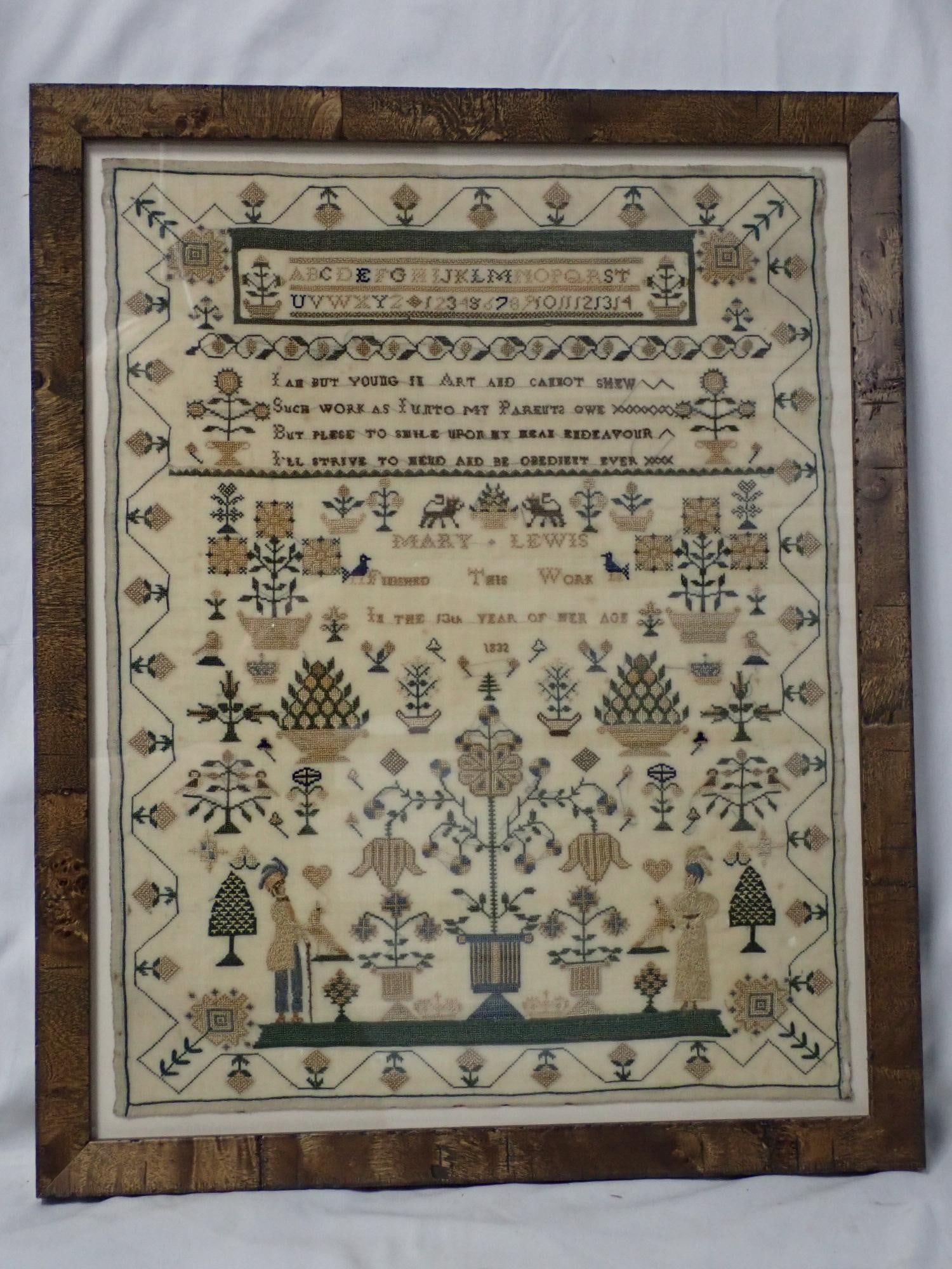 1832 Mary Lewis Sampler: Mary Lewis Finished This Work In the 13th Year of her Age 1832. Alphabet, numbers, verse at top. Motif floral, fauna and a man and woman. Vibrant blue and gold colors. Some discoloration and fabric lo