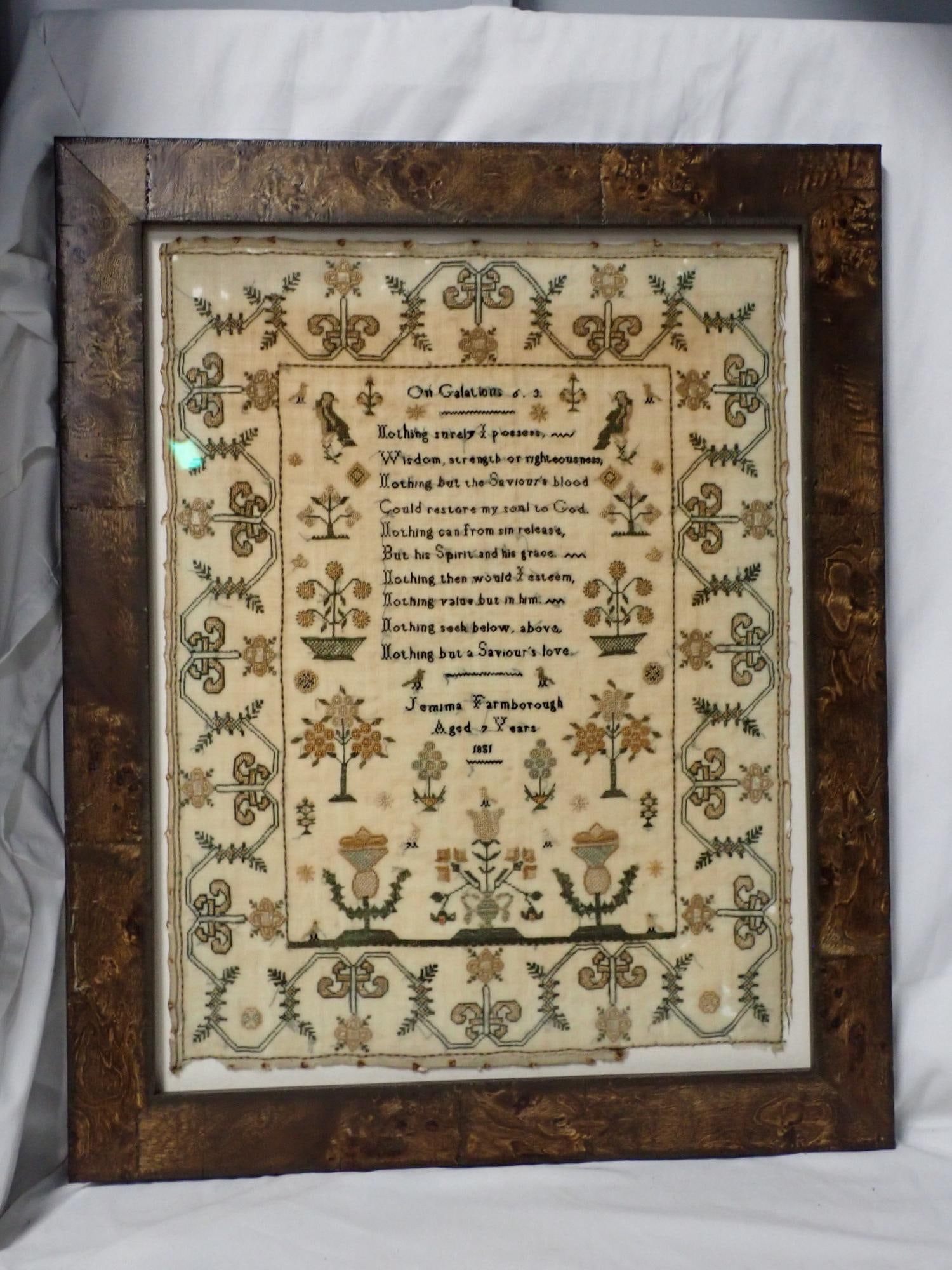 1851 Jemima Farmborough Sampler: Jemima Farmborough Aged 7 Years 1851 Religious verse in center. Geometrical border motif birds , floral. Some fabric loss along edges. Some discoloration and fading Frame 21 1/2" x 17 1/2" Sampler 17