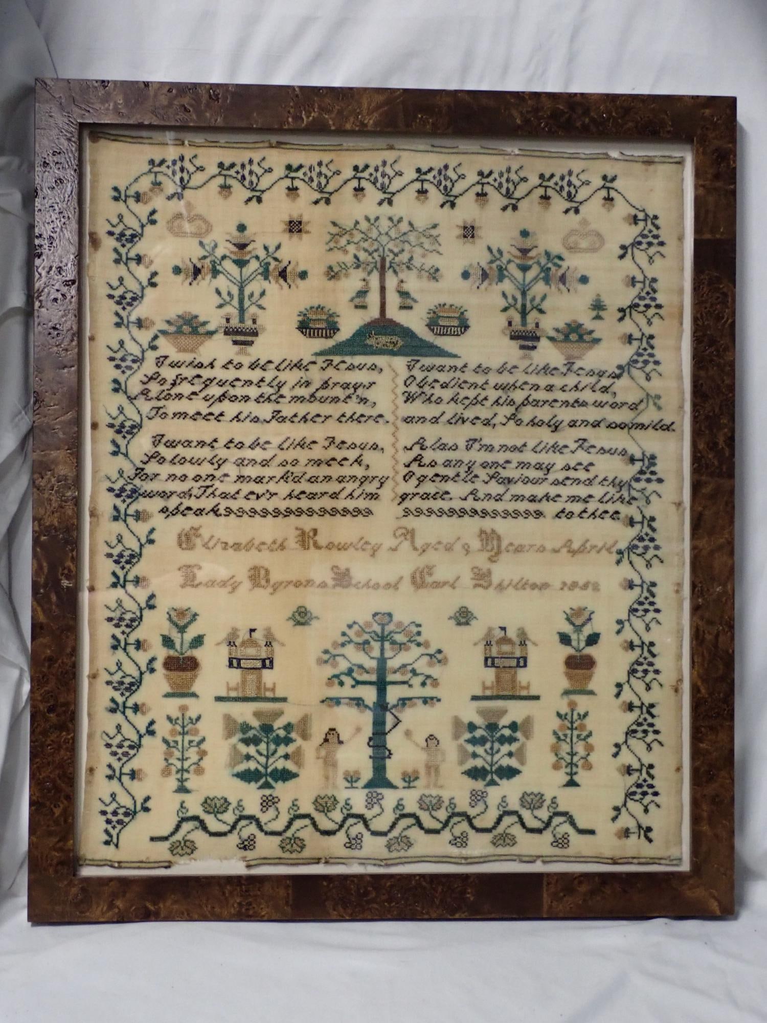 1852 Elizabeth Rowley Needwork: Elizabeth Rowley Aged 9 Years April Lady Byran School Carl S (??) 1852 Religious verses in center. Motif is floral and fauna with Adam and Eve. Nice bright blue threads. Vine border . discoloration