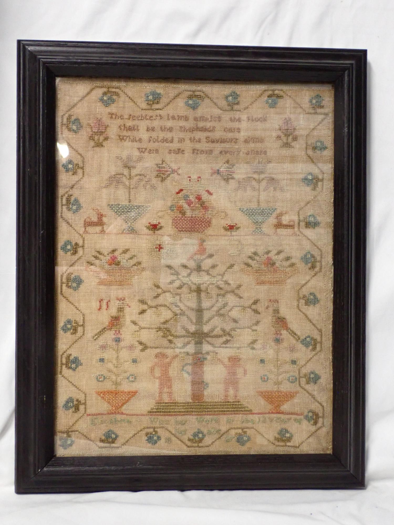 1827 Elizabeth Wise Sampler: Elizabeth Wise her work in the 12th year of her age 1827. Religous verse on top. Motif is Adam and Eve. Animals florals. Vine and floral border. Fabric discoloration. Frame 18 1/2" x 14 1/2" Sampler 1