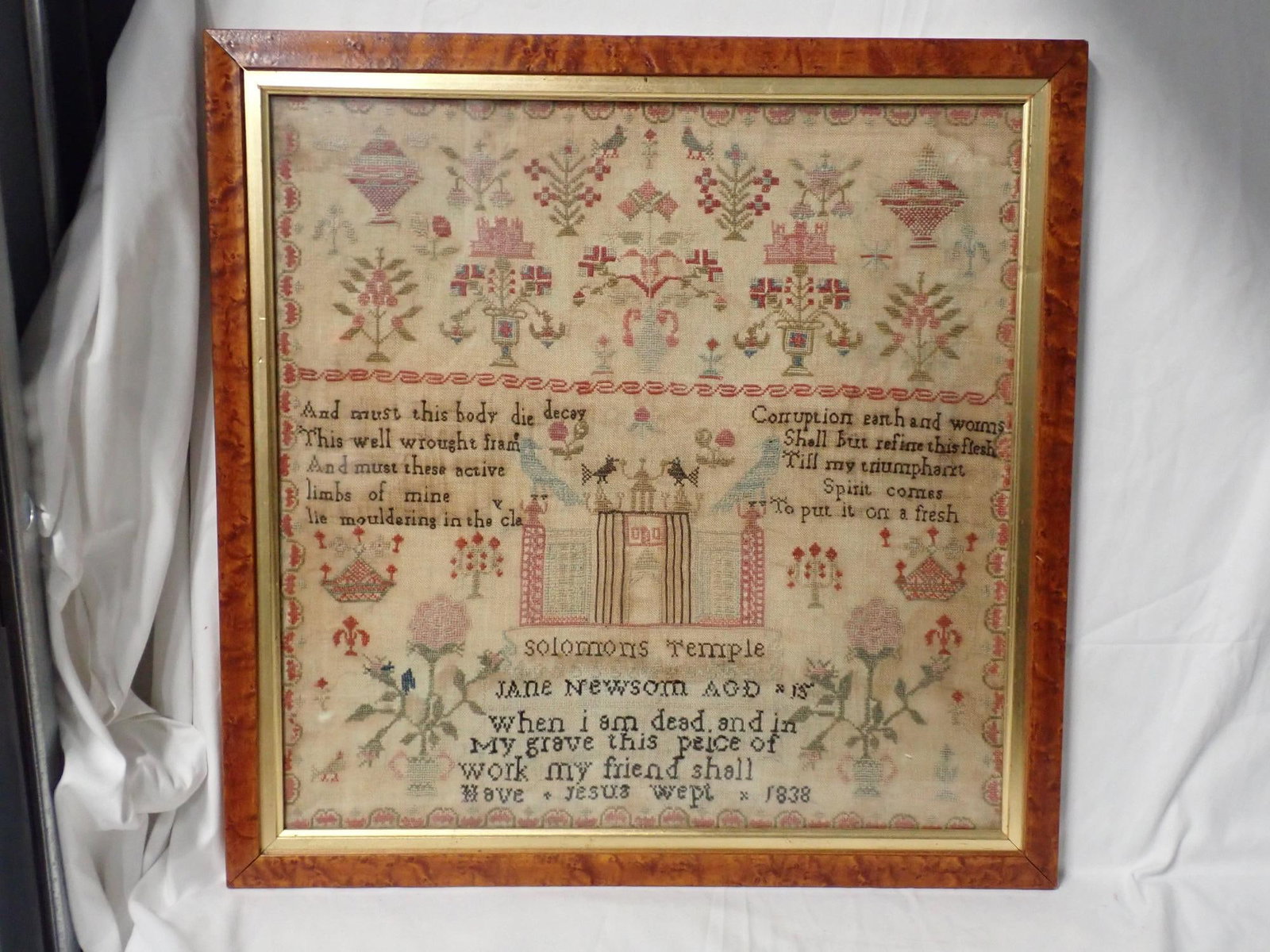 1838 Jane Newsom Sampler: Jane Newsom Age 15.Dark Religious verse regarding death. Motif is floral with Solomon's Temple. Some fabric loss and staining Frame 20 20 Sampler 17" x 17"