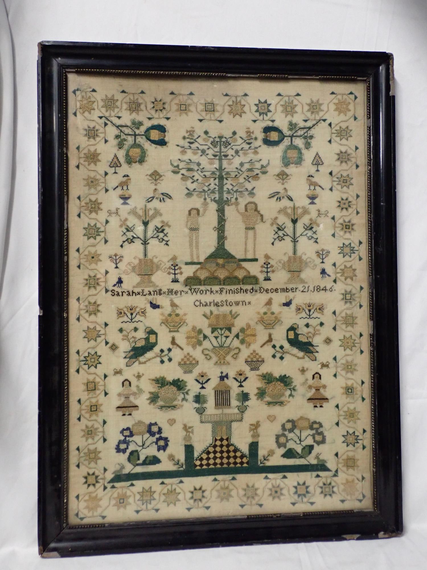 1846 Sarah Lang sampler: Sarah Lang Her Work Finished December 21, 1846. Charlestown Motif Adam and Eve floral, fauna , birds, etc. Border vines and geometrical flowers. Some fabric loss and discoloration Frame 21" x 15 1/4" 