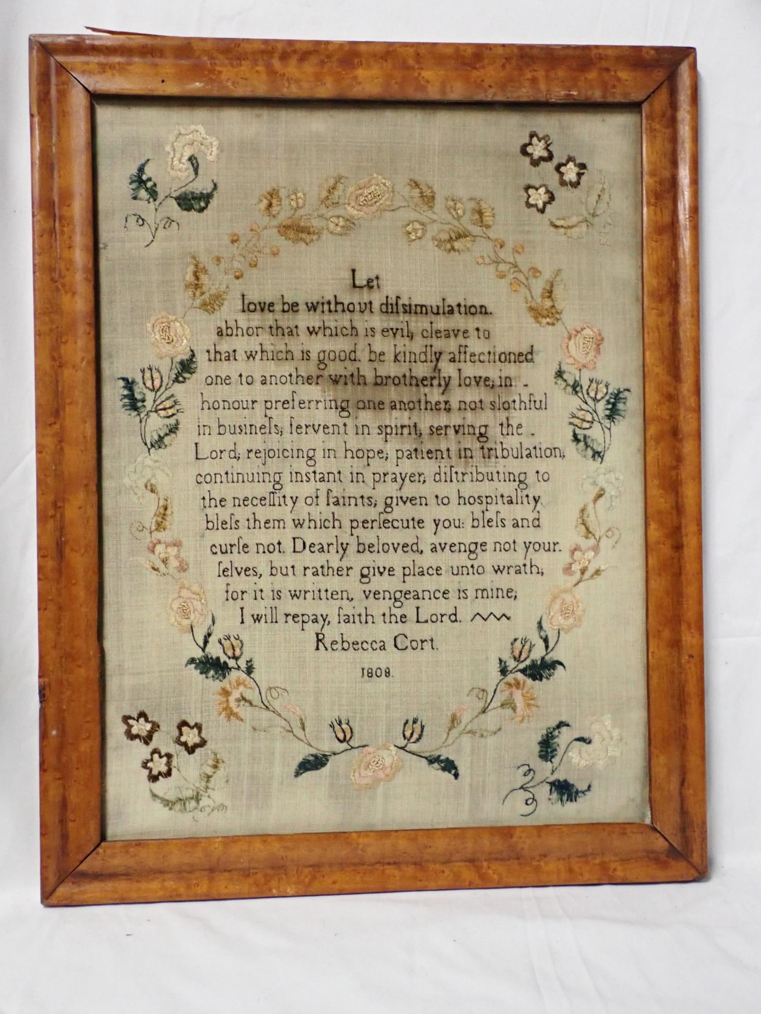 1808 Rebecca Cort Sampler: Rebecca Cort 1808 religious verse set inside a floral circular border. Some thread bleeding Frame 19 3/4" x 15 1/2" Sampler 16 3/4" x 12 1/2"