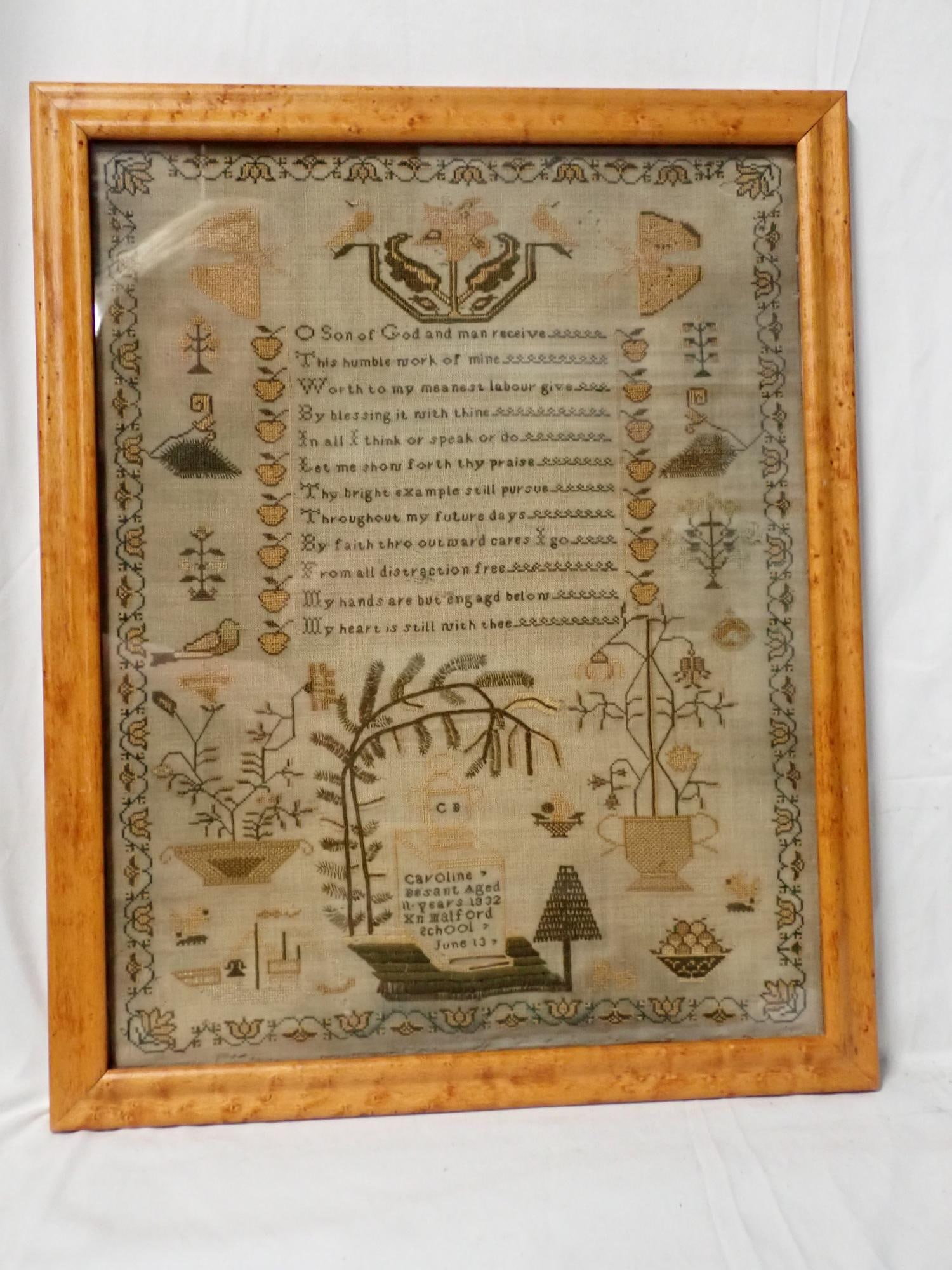 1832 Caroline Besant Sampler: Caroline Besant Aged 11 years 1832 (?) Malford school June 13. Verse in center. Motif birds, floral baskets, ships, butterflies. Vine and floral border . Some fabric loss and fabric discoloration