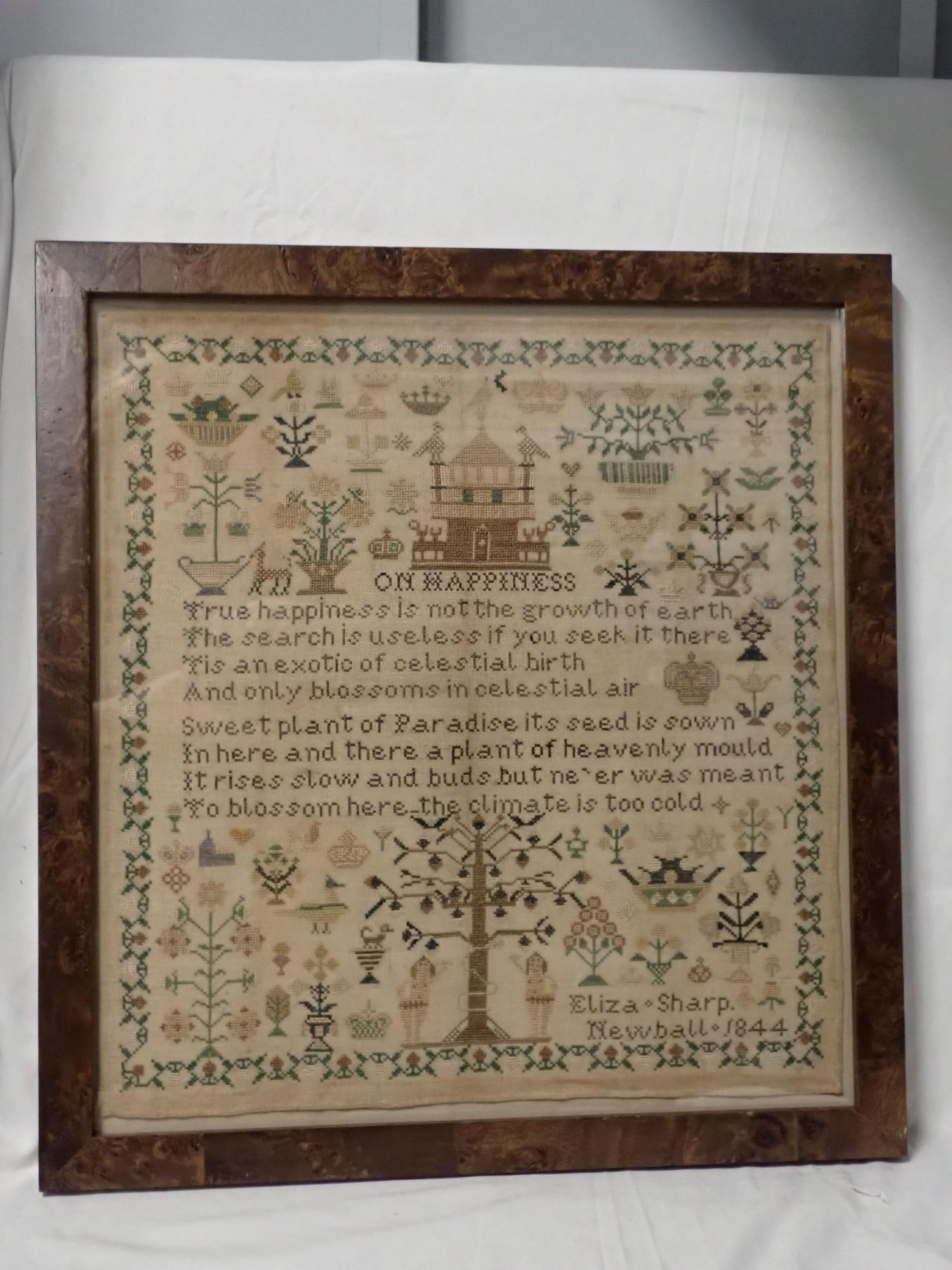 1844 Eliza Sharp Newball Sampler: Eliza Sharp Newball 1844 Verse "On Happiness". Motif Building, Adam and Eve, flowers, animals. Vine and floral border. Slight fabric discoloration. Frame 20"x 18 3/4" Sampler 17" x 16 1/4"
