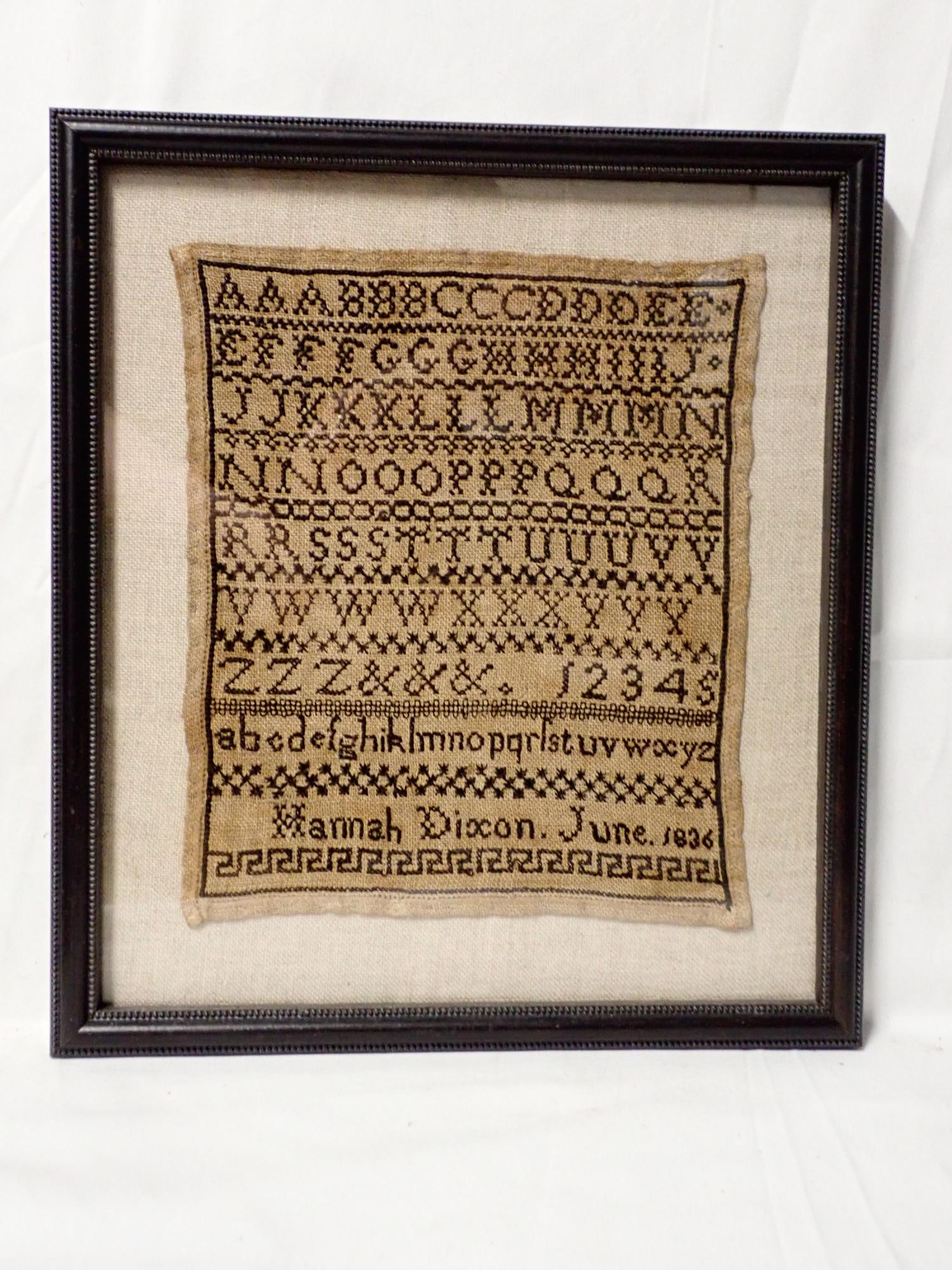 1836 Hannah Dixon Sampler: Hannah Dixon June 1836 Alphabet and numbers. fabric discoloration. Frame 12 1/4" x 11" Sampler 9" x 7 1/2"