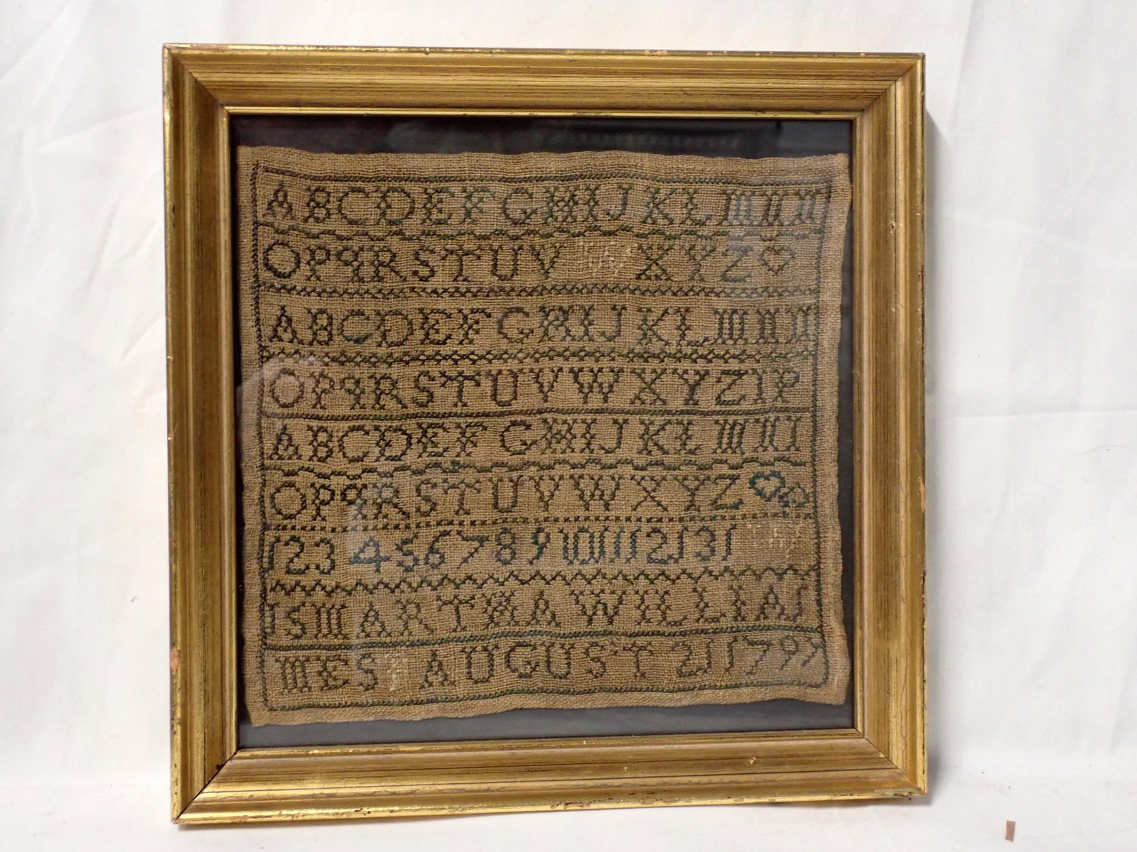 1797 Martha Williams Sampler: Martha Williams August 21 1797 Alphabet and numbers. Some ancestry data included Frame 10 1/4" x 10 1/4" Sampler 7 3/4" x 8 1/2"