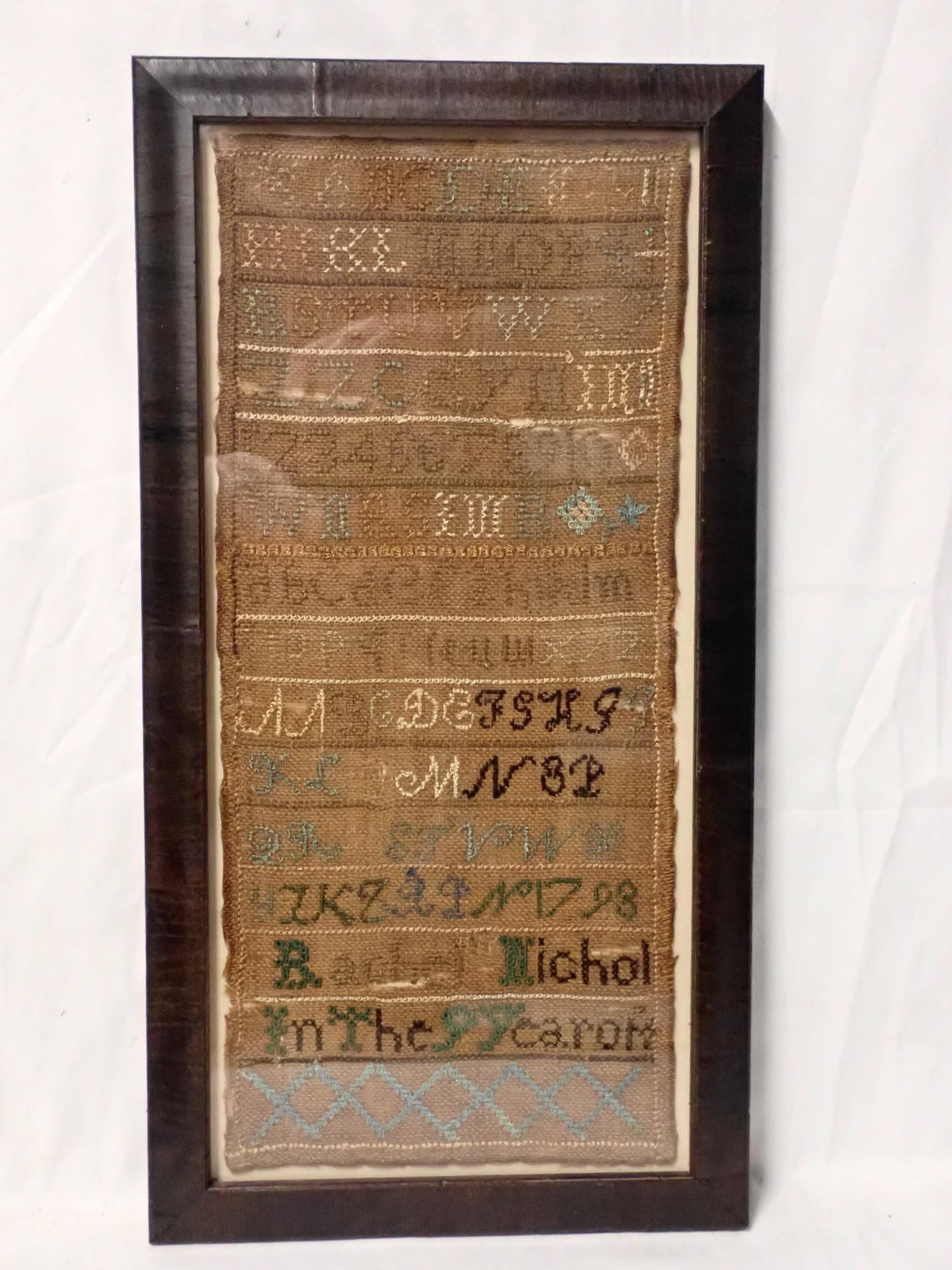1798 Rachel Nichol Sampler: 1798 Rachel Nichol in the 9 Year of. Alphabet and numbers. Thread fading. Fabric discoloration. Frame 15" x 7 3/4" Sampler 13" x 5 3/4"