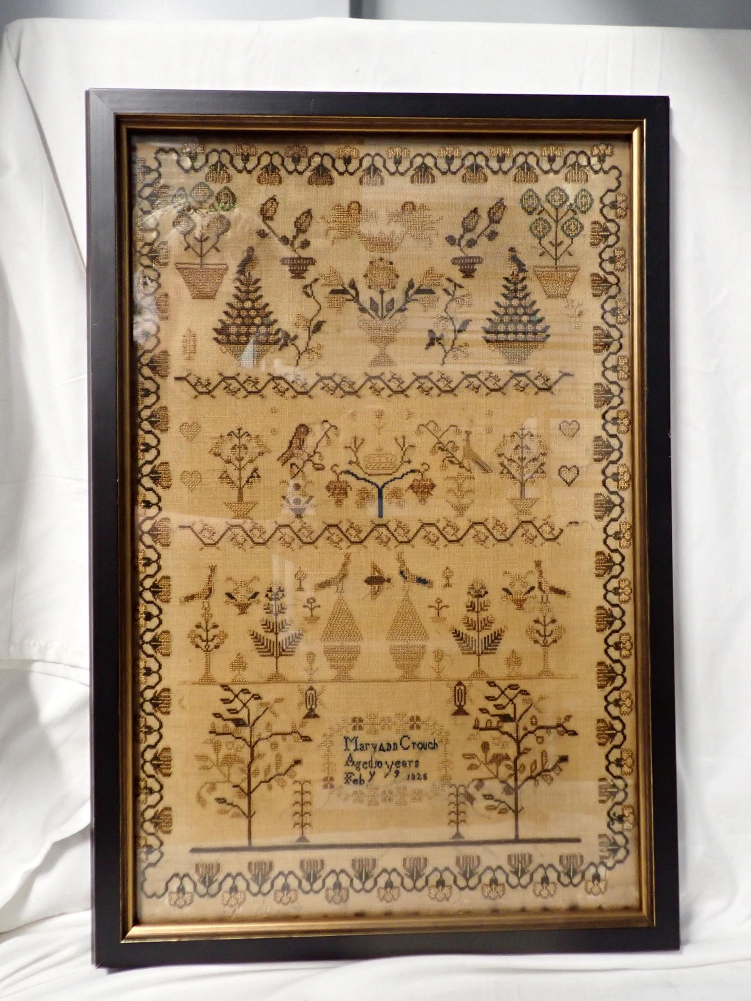 1825 Maryann Crouch Sampler: Maryann Crouch Aged 10 years Feby 9 1825. Motif trees, cherubs, birds, flowers. Vine and flower border. Some fabric loss and discoloration. Frame 22 1/4" x 15 1/4". Sampler 19 3/4" x 12 1/2"